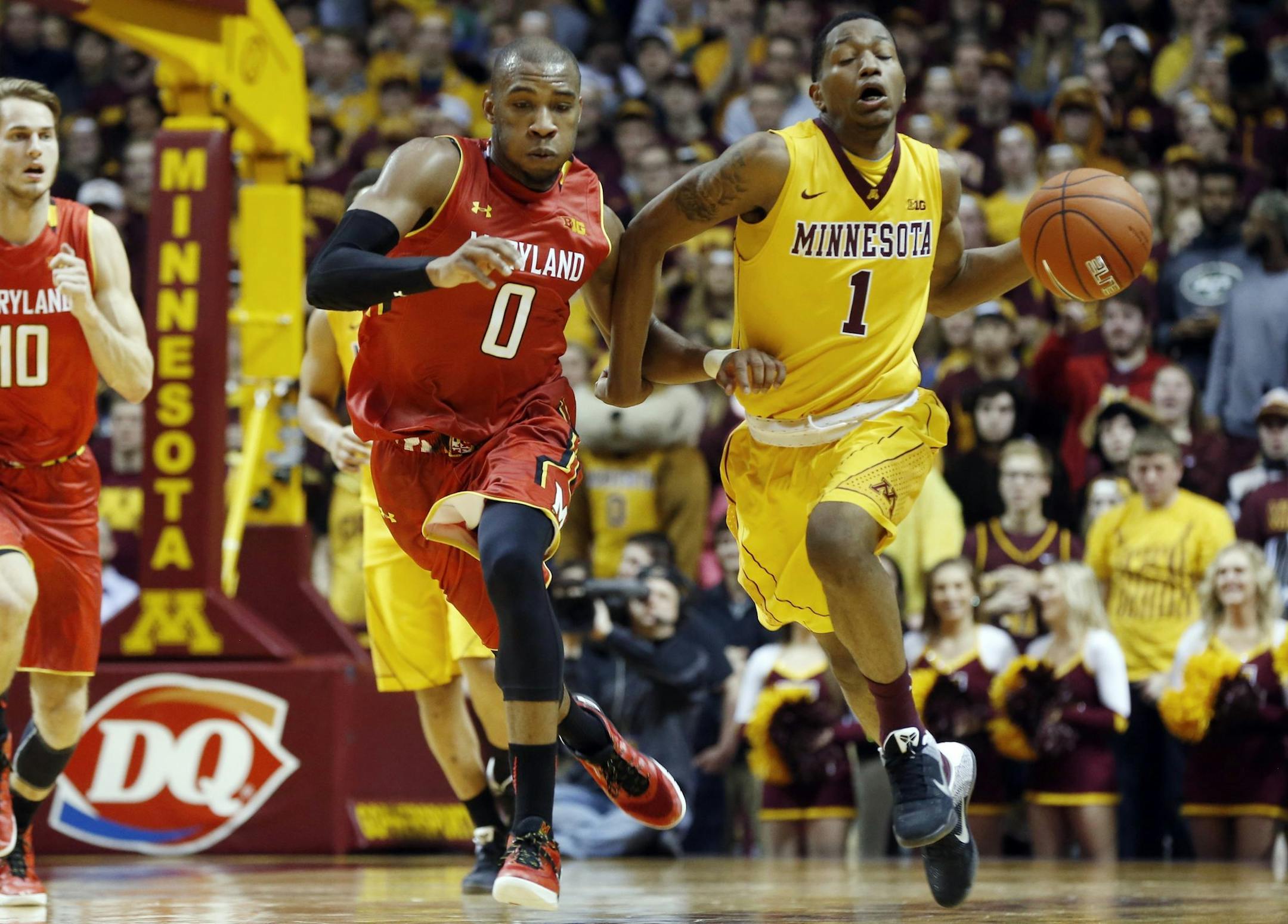 Maryland's Rasheed Sulaimon, left, chases Minnesota's Dupree McBrayer during the second half of an NCAA college basketball game Thursday, Feb. 18, 2016, in Minneapolis. Minnesota won 68-63, their first Big Ten win. (AP Photo/Jim Mone)