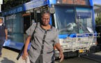 Fontainebleau housekeeper Odelie Paret heads off to catch a second bus as she heads home during her 13.5-mile journey between her job on Miami Beach a