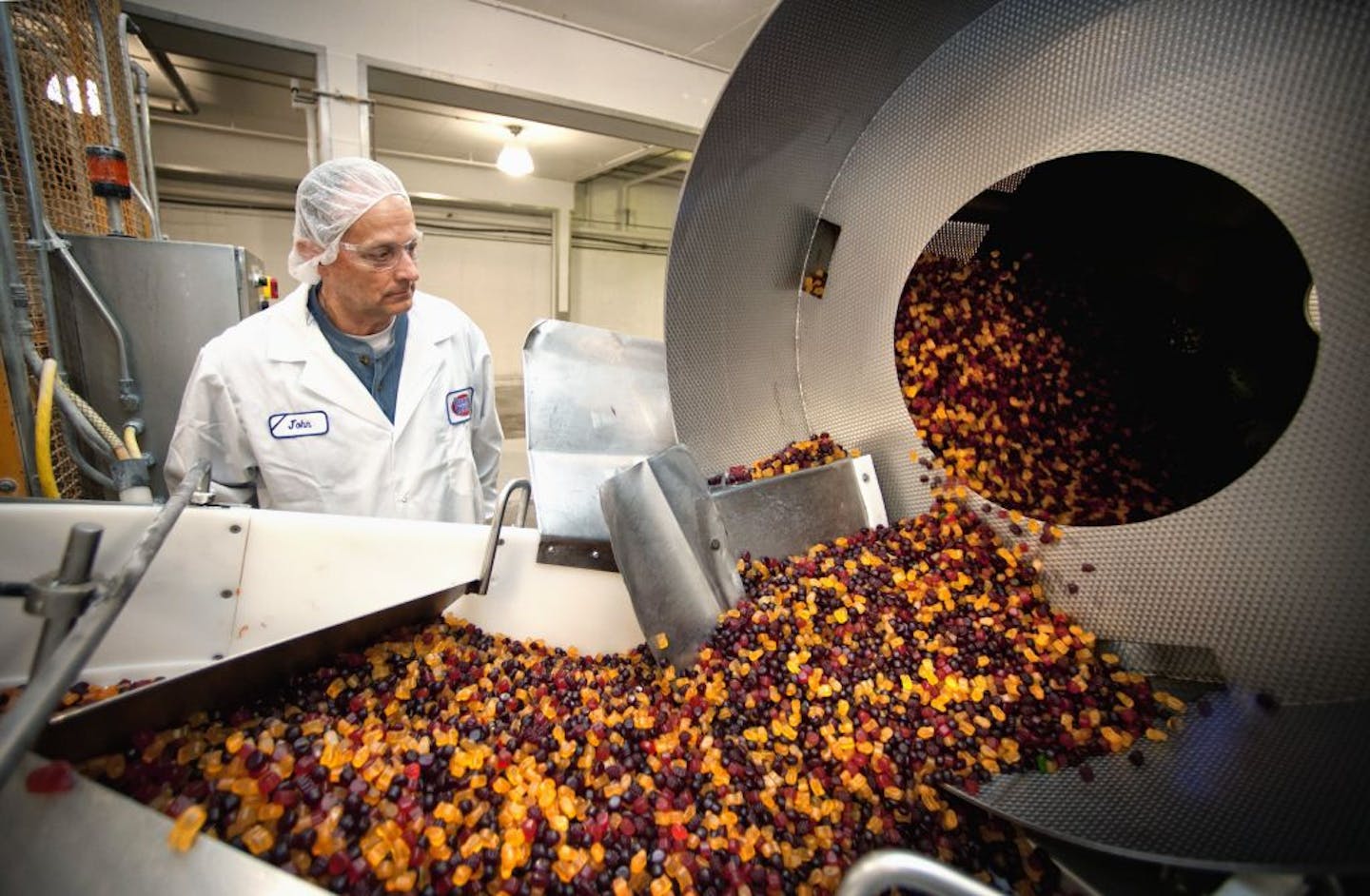 Manager John Jackson watched a batch of gummi fruit mix at Farley's & Sathers' Winona plant. The company also owns Brach's.