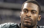FILE - This Dec. 12, 2010, file photo shows Philadelphia Eagles quarterback Michael Vick after an NFL football game against the Dallas Cowboys, in Arl