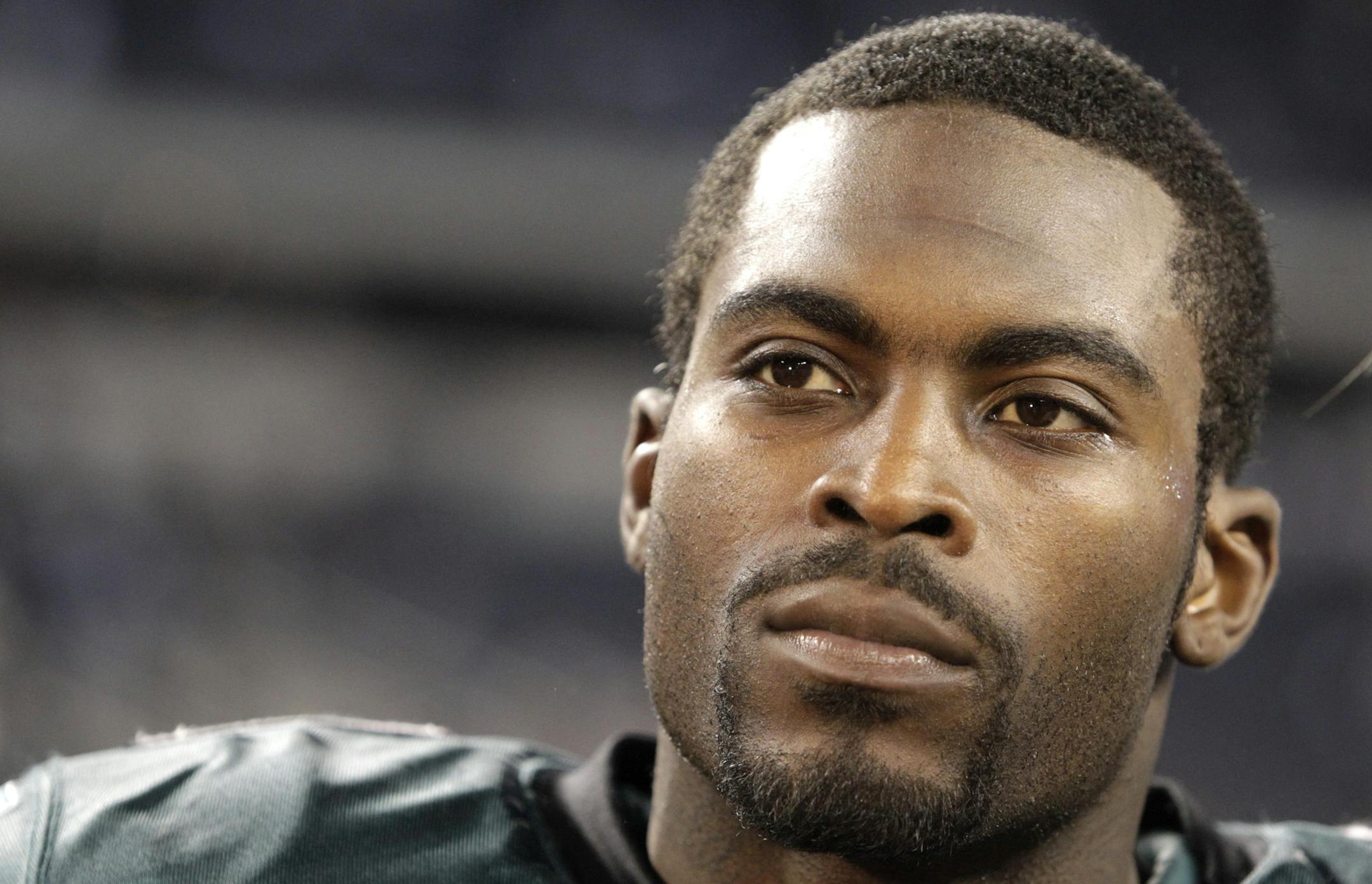 FILE - This Dec. 12, 2010, file photo shows Philadelphia Eagles quarterback Michael Vick after an NFL football game against the Dallas Cowboys, in Arlington, Texas. The convicted dogfighting-ring operator tells TheGrio.com in a video interview that he genuinely cares for animals and one day hopes to have a dog as a household pet. Vick says it would a "big step" in his rehabilitation process.(AP Photo/LM Otero, File)