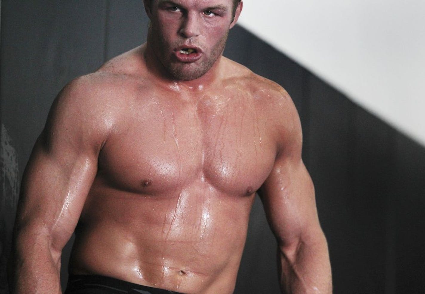 Fighter Paul Bradley, top, from Minneapolis, who fights at 170 pounds, sweated it out while working out at The Academy Friday, July 8, 2011.