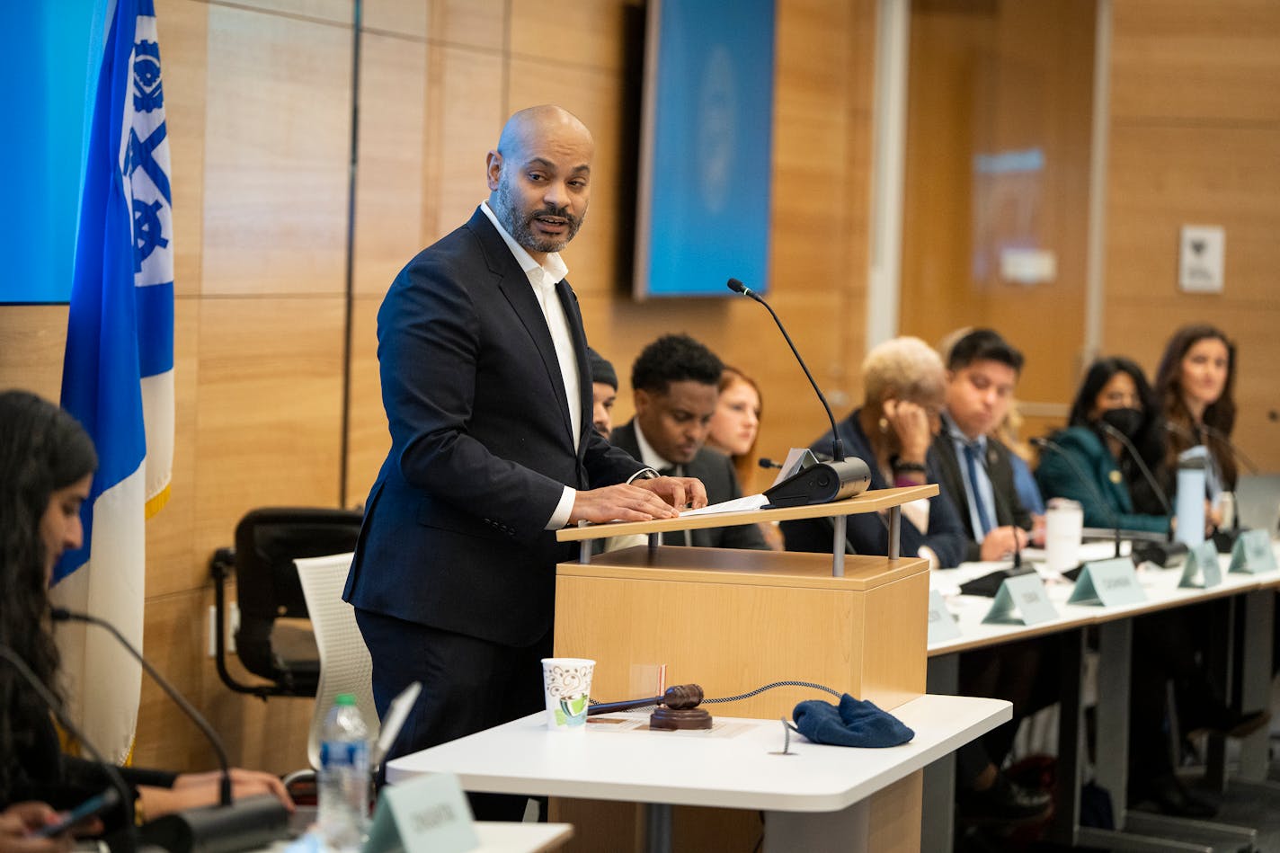 Newly elected Council President Elliott Payne stands at the podium for the first time during Minneapolis City Council's first meeting of 2024.