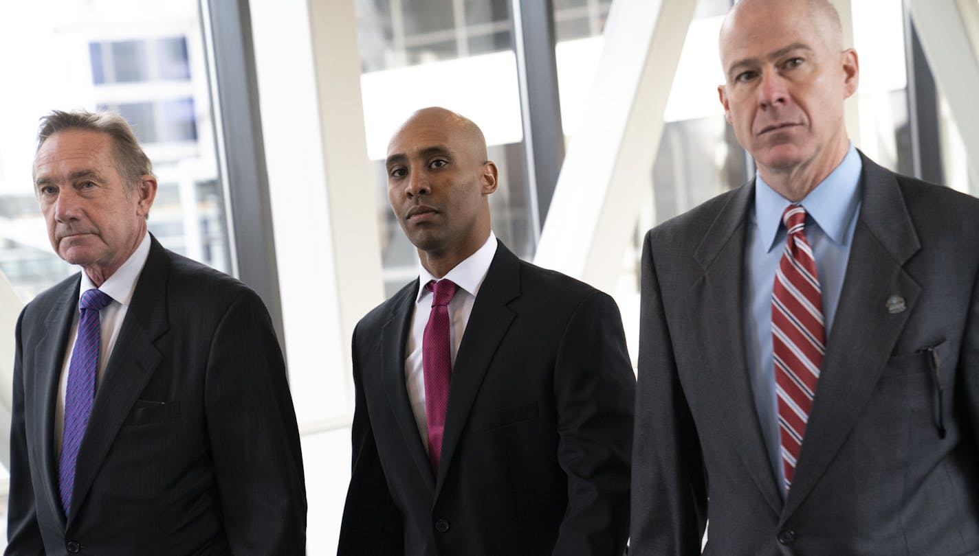 Former Minneapolis police officer Mohamed Noor, center, arrived for the first day of jury selection with his attorney's Peter Wold, left, and Thomas Plunkett, right, at the Hennepin County Government Center in Minneapolis, Minn., on Monday, April 1, 2019.