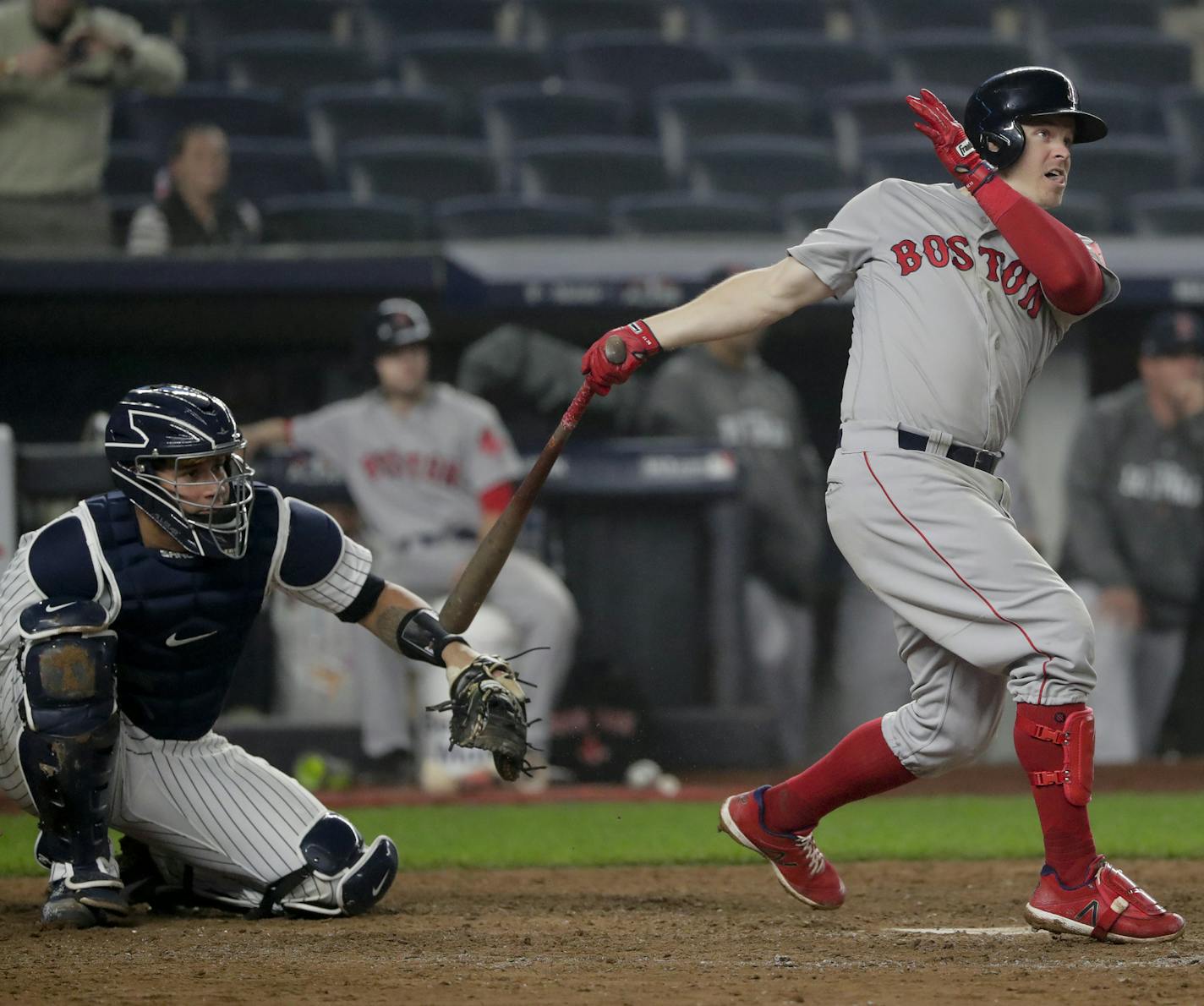 Boston Red Sox's Brock Holt follows through on a two-run home run against the New York Yankees during the ninth inning of Game 3 of baseball's American League Division Series, Monday, Oct. 8, 2018, in New York. Holt hit for the cycle in the Red Sox's 16-1 win. (AP Photo/Frank Franklin II)