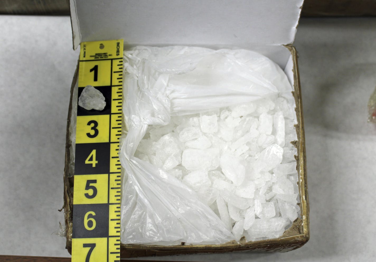 This photo provided by the Cannon River Drug and Violent Task Force shows a box containing methamphetamine. Authorities said Friday, Sept. 14, 2018 that task force agents assisted by a Minneapolis police SWAT team seized just under 171 pounds of meth with an estimated street value of $7.75 million on Tuesday, and arrested four suspects who've now been charged. (Cannon River Drug and Violent Task Force via AP)