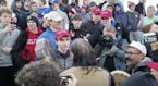 In this Friday, Jan. 18, 2019 image made from video provided by the Survival Media Agency, a teenager wearing a "Make America Great Again" hat, center