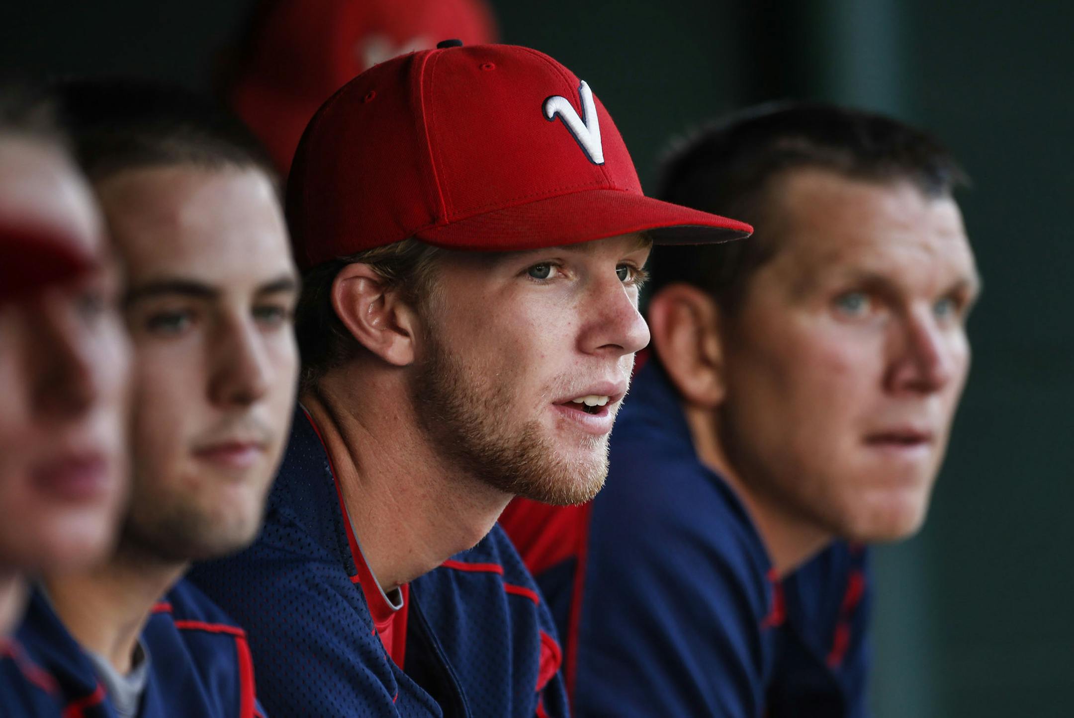 Victoria Vic's pitcher Kasey Ralston, who was nearly killed in a car accident a year ago and made an amazing comeback, didn't start Friday, Aug. 1, 2014, at Poppitz Field in Victoria, MN. Instead, he sat with teammates, taking his team's game with Prior Lake.] (DAVID JOLES/STARTRIBUNE) djoles@startribune Former Holy Family star pitcher Kasey Ralston, who was nearly killed in a car accident a year ago and now, to the amazement of many, is pitching again. His Victoria Vic's team is on the verge of