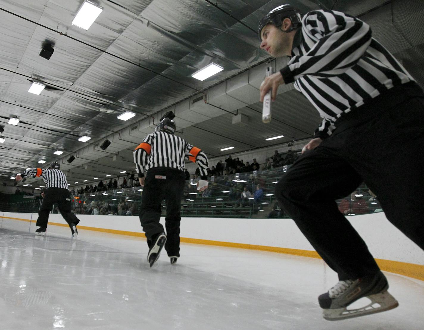 Hockey referees Jerry McLaughlin, Joel Lombard and Josh Lupinek, took the ice before a game between Edina and Maple Grove High school at Braemar Arena. ] CARLOS GONZALEZ cgonzalez@startribune.com, January 12, 2012, Edina. Minn, Braemar Arena, High School Hockey Referees ORG XMIT: MIN2015070214525450