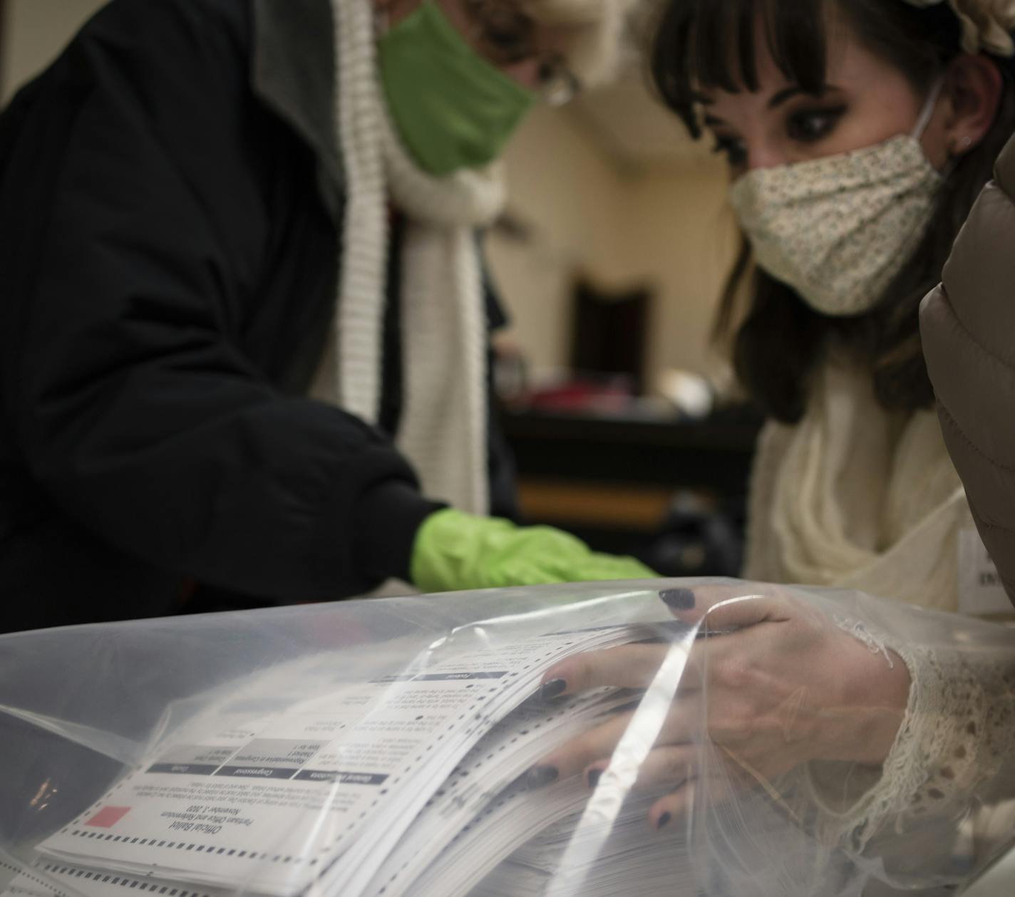 Election staff members pack ballots after polls closed at the Moose Lodge on Election Day, Tuesday, Nov. 3, 2020, in Kenosha, Wis. (AP Photo/Wong Maye-E)