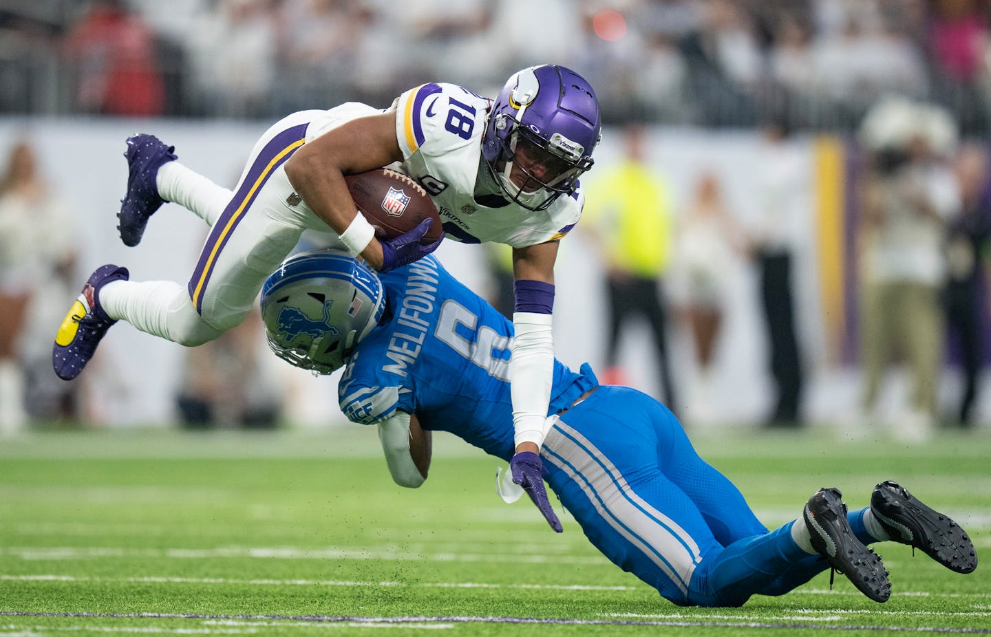 Minnesota Vikings wide receiver Justin Jefferson (18) was upended by Detroit Lions safety Ifeatu Melifonwu (6) in the second quarter after picking up a first down Sunday December ,24,2023 in, Minneapolis , Minn. ]  JERRY HOLT • jerry.holt@startribune.com