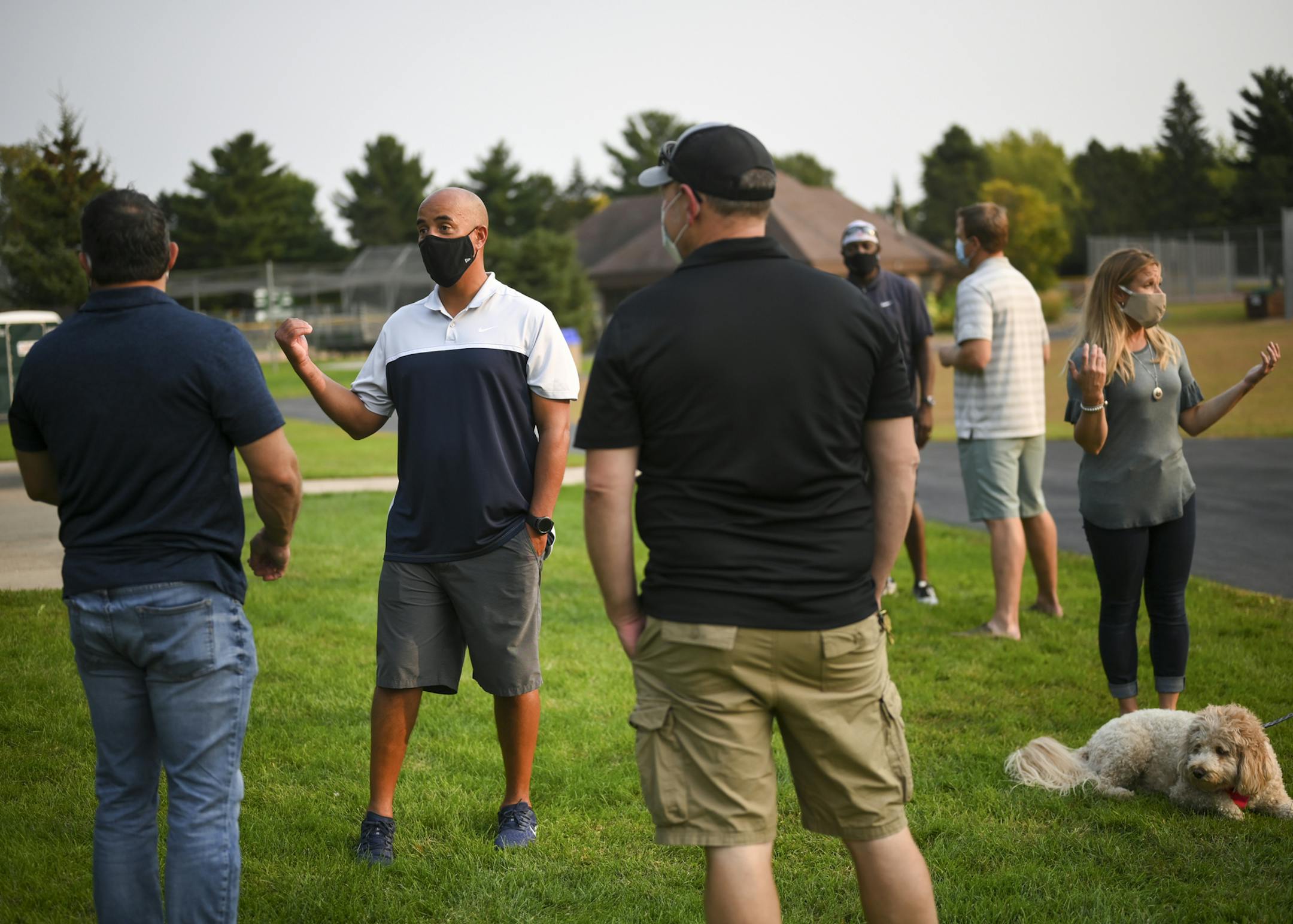 Shoreview City Council candidate Dave Olson, second from left, met with constituents and supporters Tuesday afternoon at Sitzer Park. ] aaron.lavinsky@startribune.com Gophers team doctor David Olson is running for Shoreview City Council and would be the first Black council member in that district. He's running to try to help make changes for racial inequality and social injustice in the Twin Cities. We photograph Olson as he hosts a meet-and-greet event on Tuesday, Sept. 15, 2020 at Sitzer Park