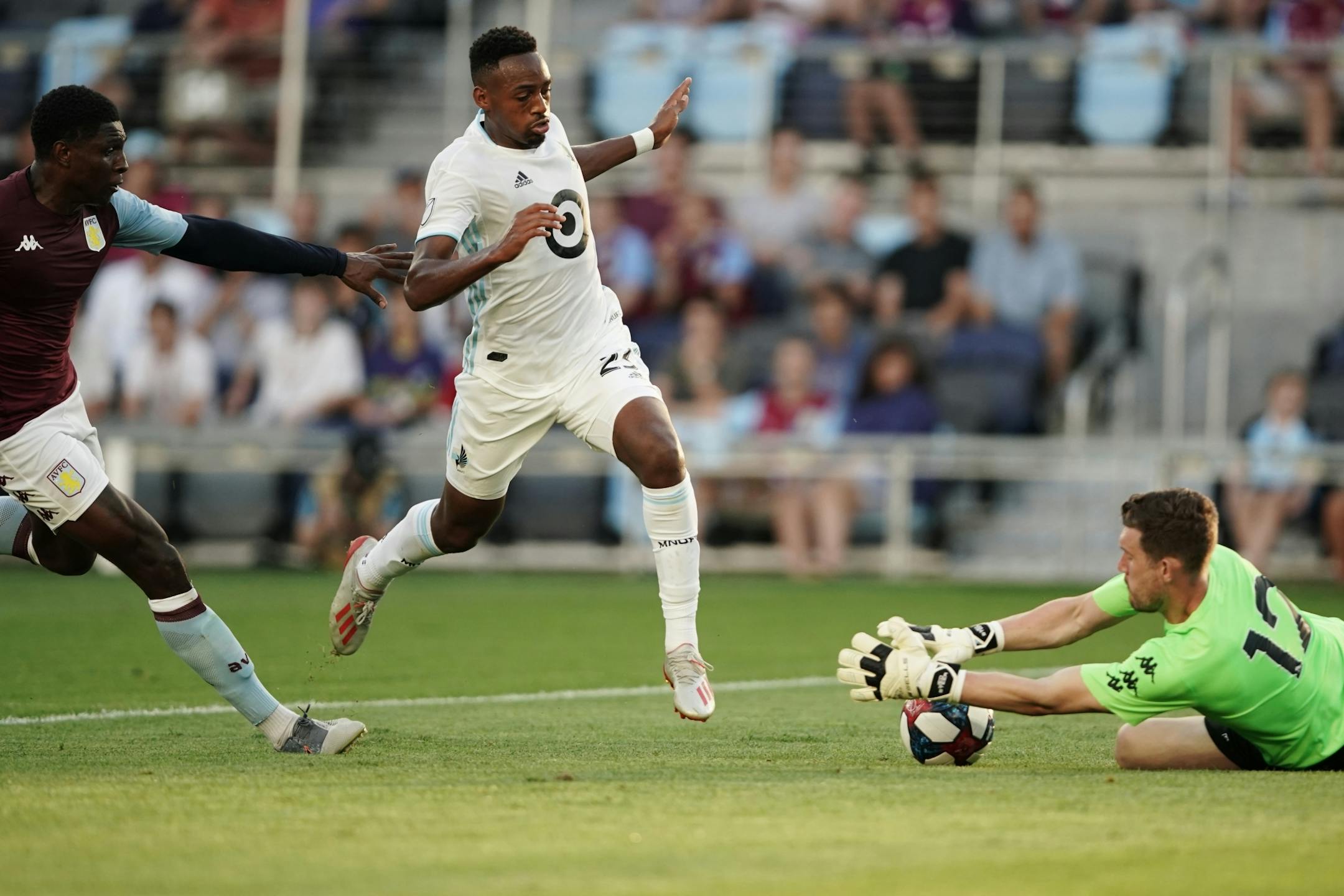 Aston Villa goalkeeper Jed Steer (12) intercepted a drive by Minnesota United forward Mason Toye (23). Aston Villa and the Minnesota United remained tied 0-0 at the end of the first half.