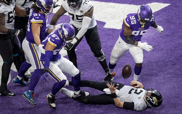 Jacksonville Jaguars quarterback Mike Glennon (2) fumble the ball in the end zone after his was sacked for a safety by Minnesota Vikings defensive end