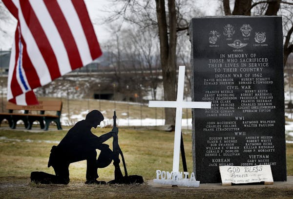 A cross was removed from a kneeling soldier at the veterans memorial park in Belle Plaine, MN. Advocates for the cross have been placing new ones at t