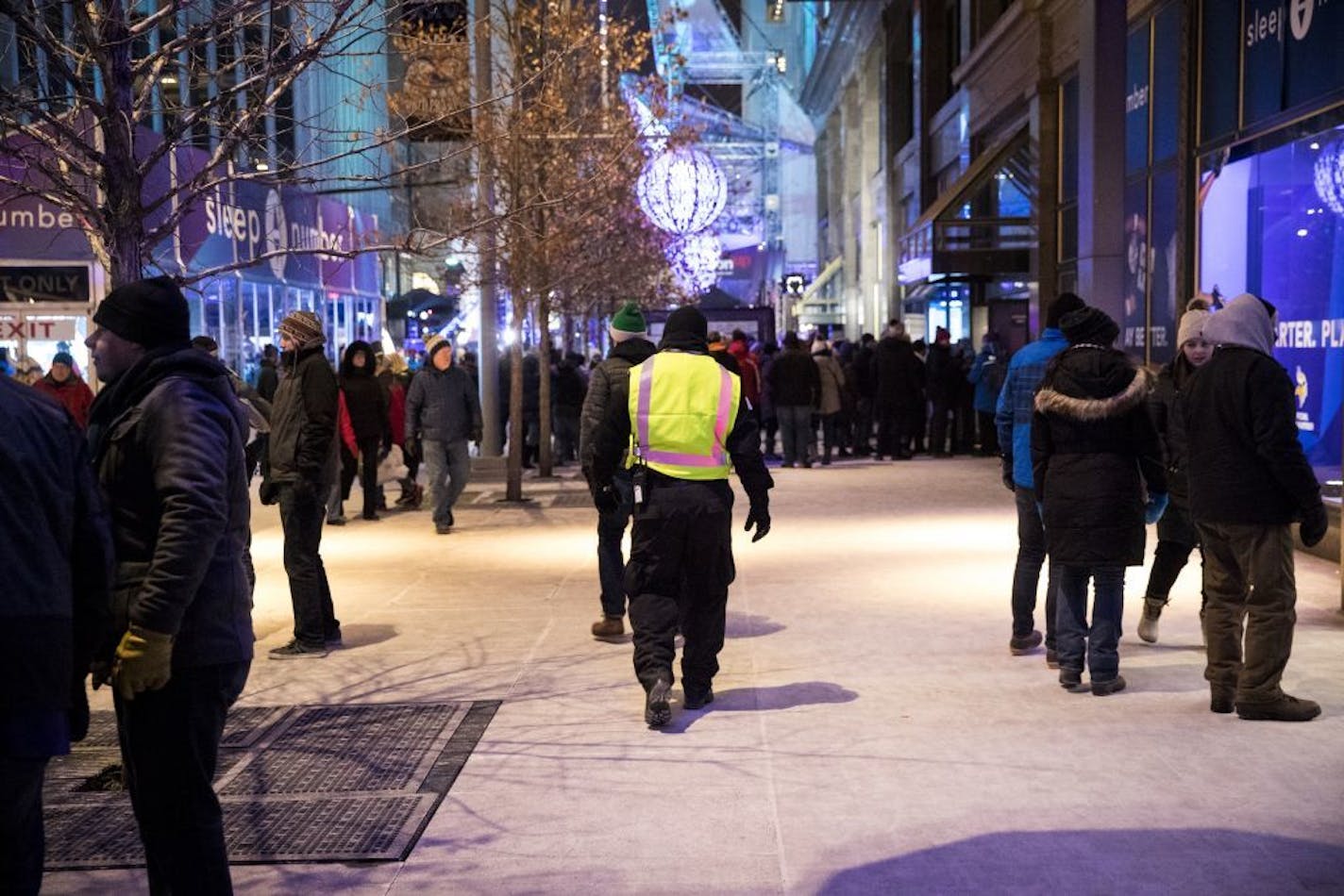 A security guard walked through the Super Bowl Live events on Nicollet Mall on Feb. 2 in Minneapolis.