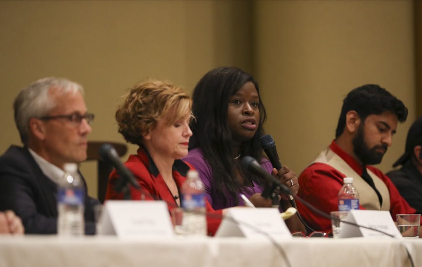 Mayoral candidates from left, Tom Hoch, Betsy Hodges, Nekima Levy-Pounds, and Aswar Rahman at a Sept. 29 forum on homelessness.