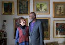 Diane and Alan Page stood in their home that is full of African American art, antiques and artifacts in 2017.