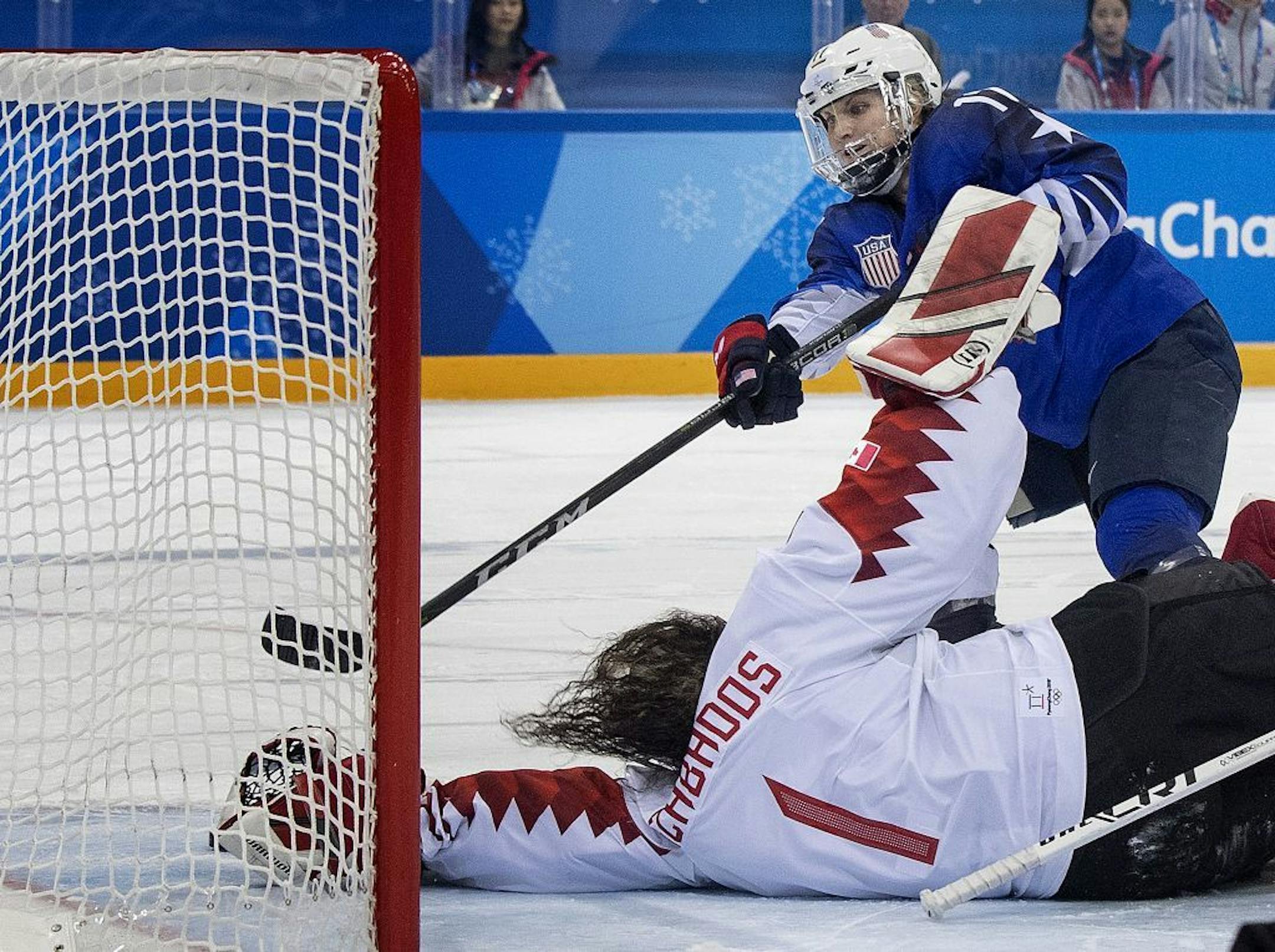 Jocelyne Lamoureux-Morando (17) shoots the puck past Canada goalie Shannon Szabados (1) during the shootout at Gangneung Hockey Centre Thursday, Feb. 22, 2018 in Pyeongchang, South Korea, during the Pyeongchang Winter Olympics.