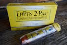 FILE - This Oct. 10, 2013, file photo, shows an EpiPen epinephrine auto-injector, a Mylan product, in Hendersonville, Texas. Facing public furor for t