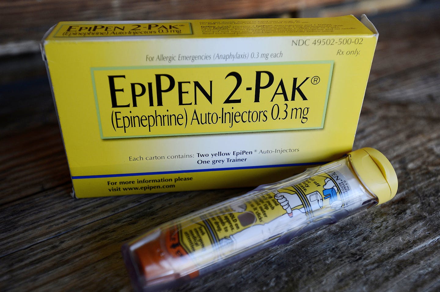 FILE - This Oct. 10, 2013, file photo, shows an EpiPen epinephrine auto-injector, a Mylan product, in Hendersonville, Texas. Facing public furor for the price of its emergency allergy shot EpiPen, Mylan Pharmaceuticals quickly pointed to a familiar industry solution: copay discount cards. Discount cards for EpiPen and other pricey drugs can help consumers lower their pharmacy costs. But don't call them a solution to skyrocketing drug prices, experts say. (AP Photo/Mark Zaleski, File) ORG XMIT: M