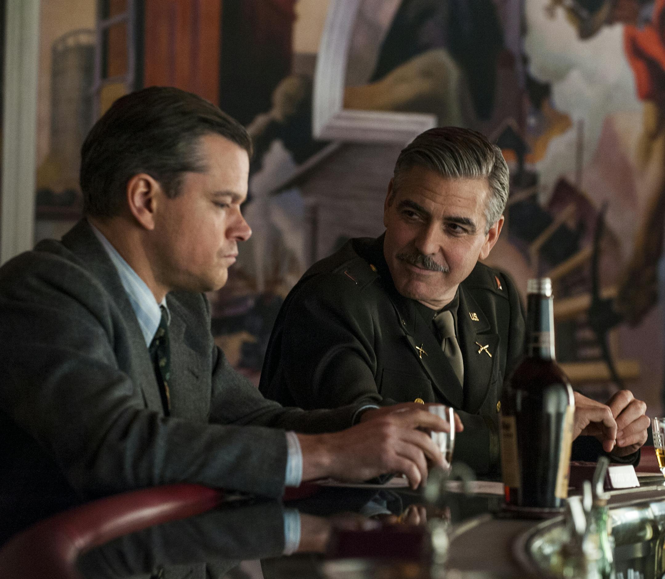 Matt Damon (left) and George Clooney in Columbia Pictures' THE MONUMENTS MEN. Photo credit: Claudette Barius ORG XMIT: George Clooney (Finalized);Matt ORG XMIT: MIN1309041129160705
