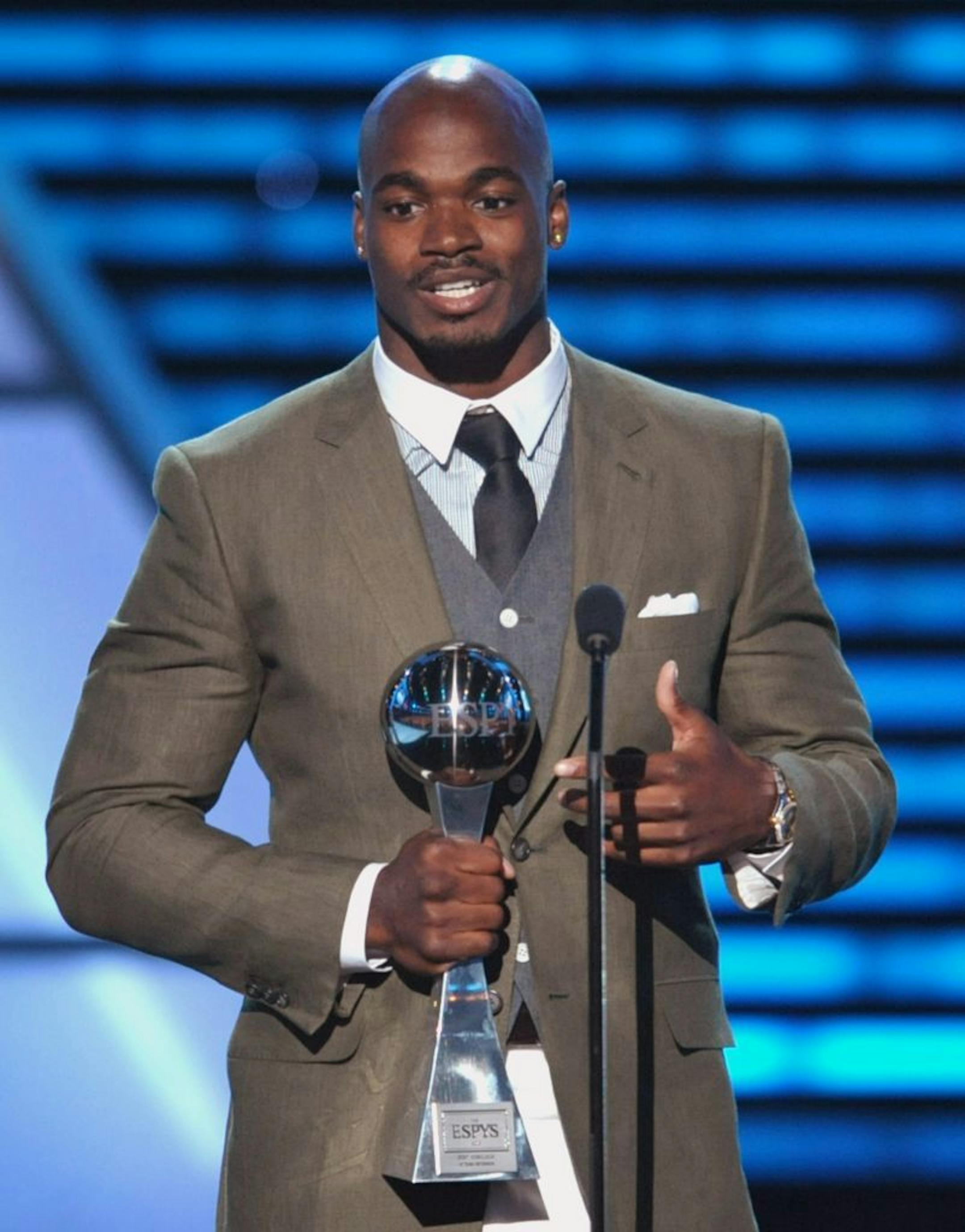 Adrian Peterson accepts the award for best comeback at the ESPY Awards on Wednesday, July 17, 2013, at Nokia Theater in Los Angeles.