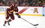 Minnesota Duluth's Scott Perunovich (7) controls the puck against Ohio State in the first period of the NCAA Frozen Four semifinal Thursday, April 5, 