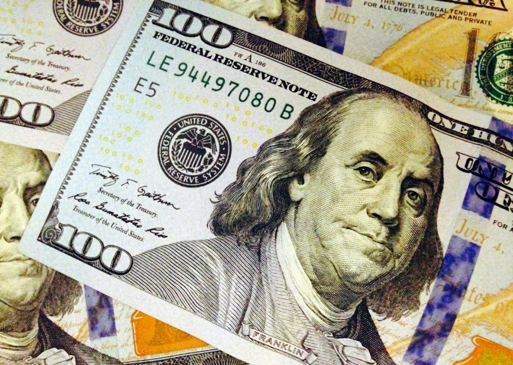 FILE - This Feb. 2, 2015, file photo, depicts a part of a U.S. $100 bill. The federal government�s two largest benefit programs face short- and long-term financial problems as they close in on milestone anniversaries. The magnitude of those problems will become clearer when the trustees for Social Security and Medicare issue their annual report cards.