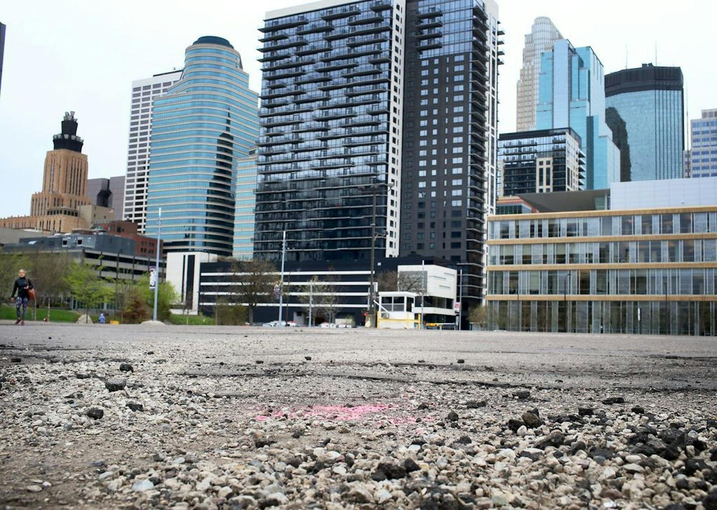 United Properties has closed on the sale of the city parking lot where the Gateway mixed-use development will be built. Here, the asphalt lot is crumbling in places at the site of the development.