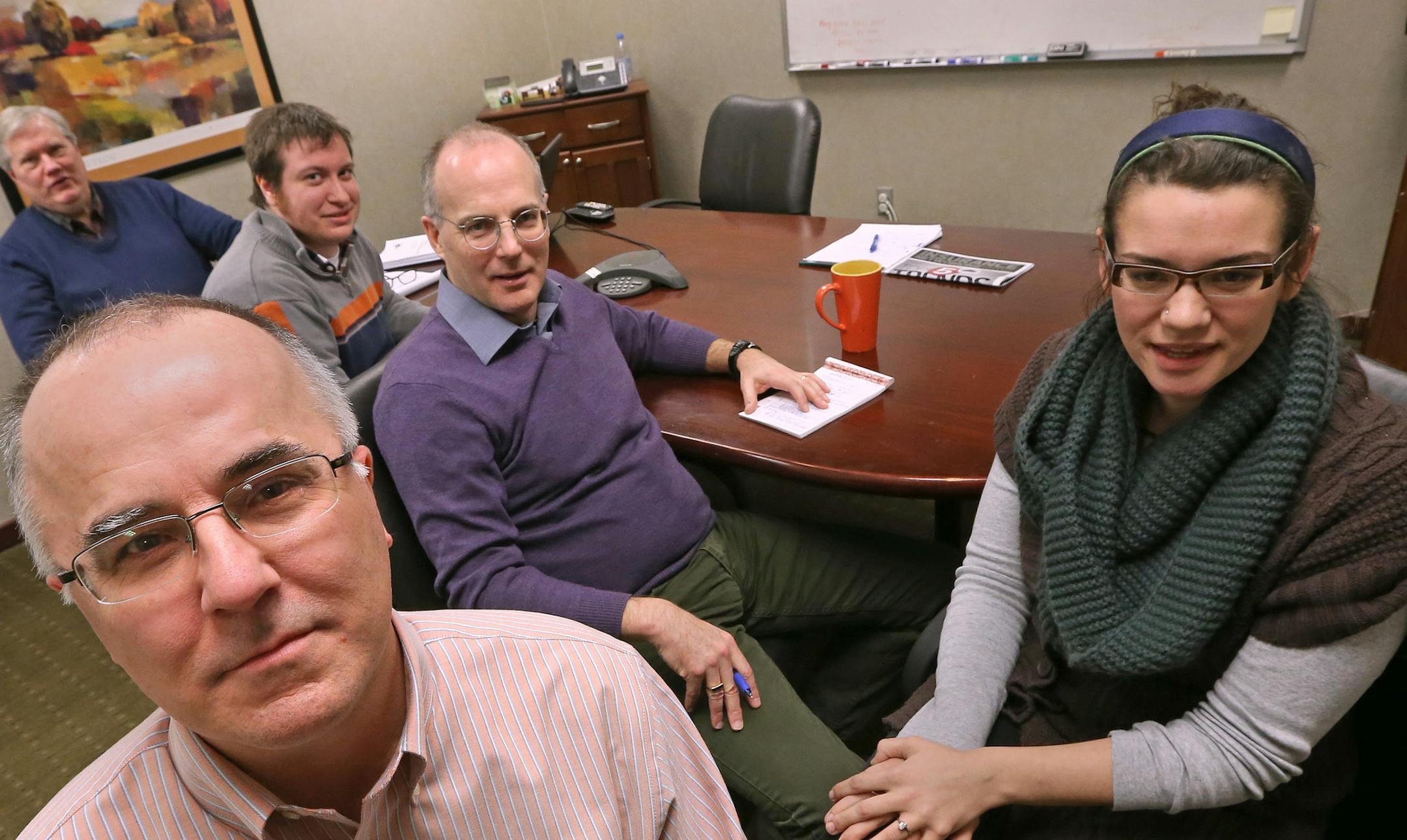 Dan Freier, front, is CFO of Deft Research, a small company that tried to use MNsure to buy coverage. Freier was photographed with employees (left to right) Steve Runfeldt, Andrew Anthony, Rich Hamer and Liz Schlimgen on Jan. 7.