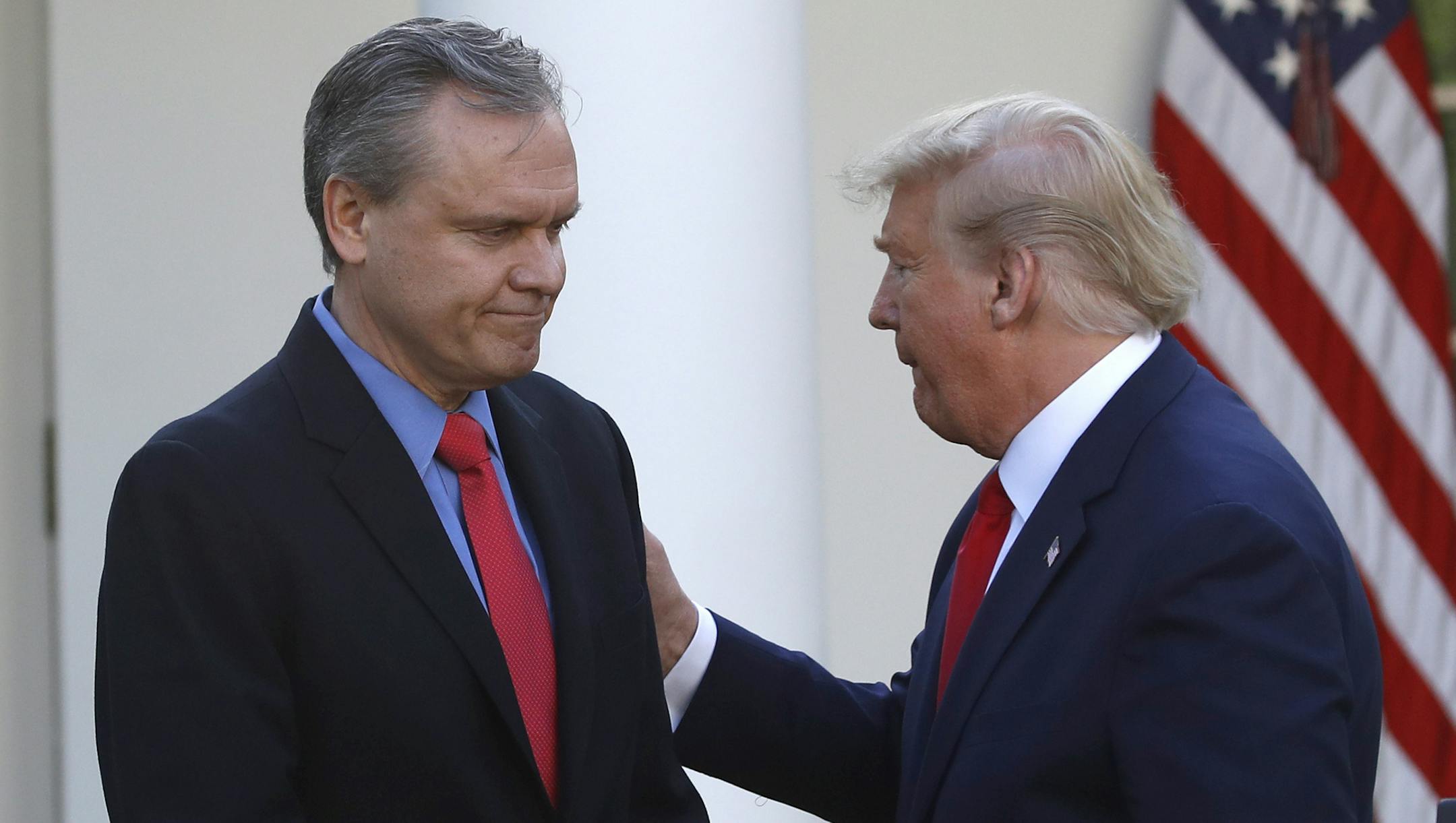 Darius Adamczyk, CEO of Honeywell, is greets by President Donald Trump as he goes to speak during a briefing about the coronavirus in the Rose Garden of the White House, Monday, March 30, 2020, in Washington. (AP Photo/Alex Brandon)