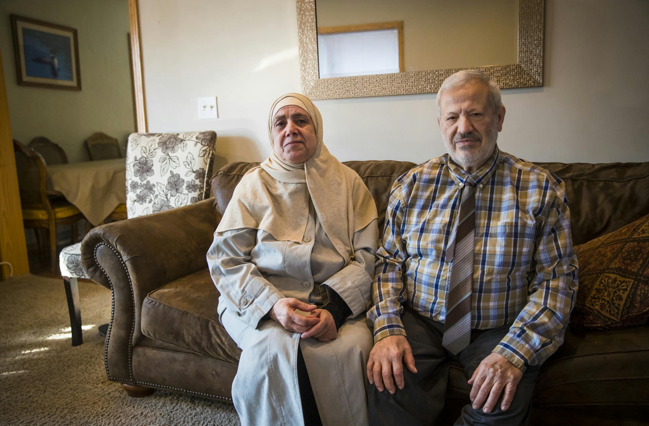Syrian immigrants Oter Alkhattab, left, and Zuhir Alsaman say the order delays the arrival of their son and his family in the U.S.