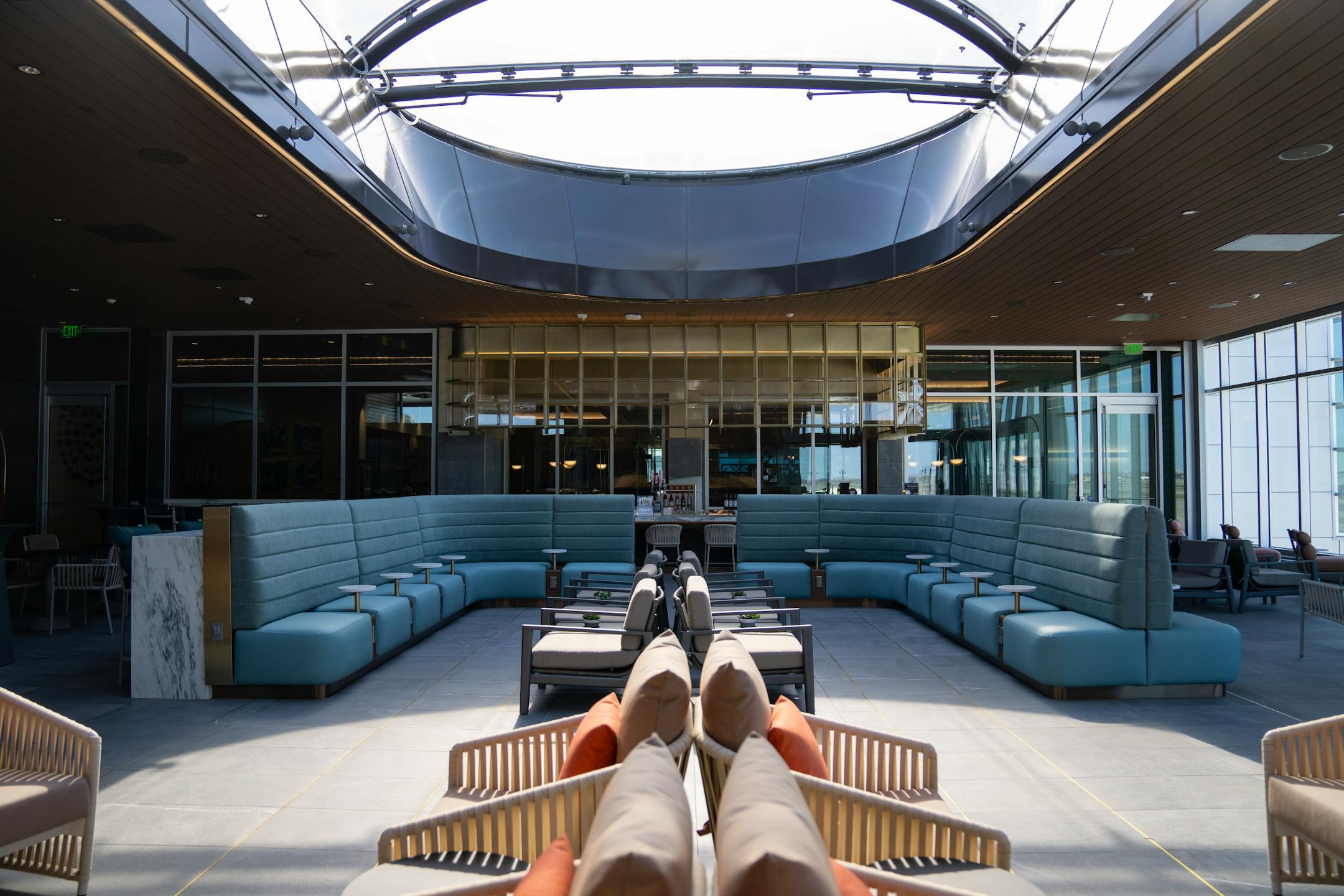 The new Delta Sky Club features a large skylight in an area with retractable windows.