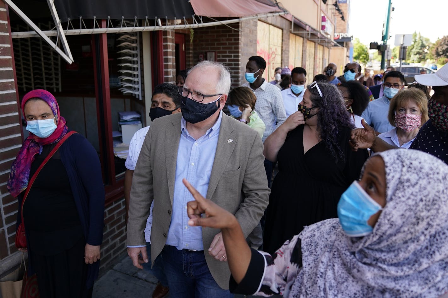 Gov. Tim Walz, Sen. Amy Klobuchar, and Sen. Tina Smith met with business owners that were affected by the looting and riots following the George Floyd protests Friday morning near Midtown Global Market on East Lake Street.