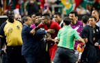 Panama's Erick Davis (15) was restrained as tempers flared during the second half of a CONCACAF Gold Cup soccer semifinal between Panama and Mexico on