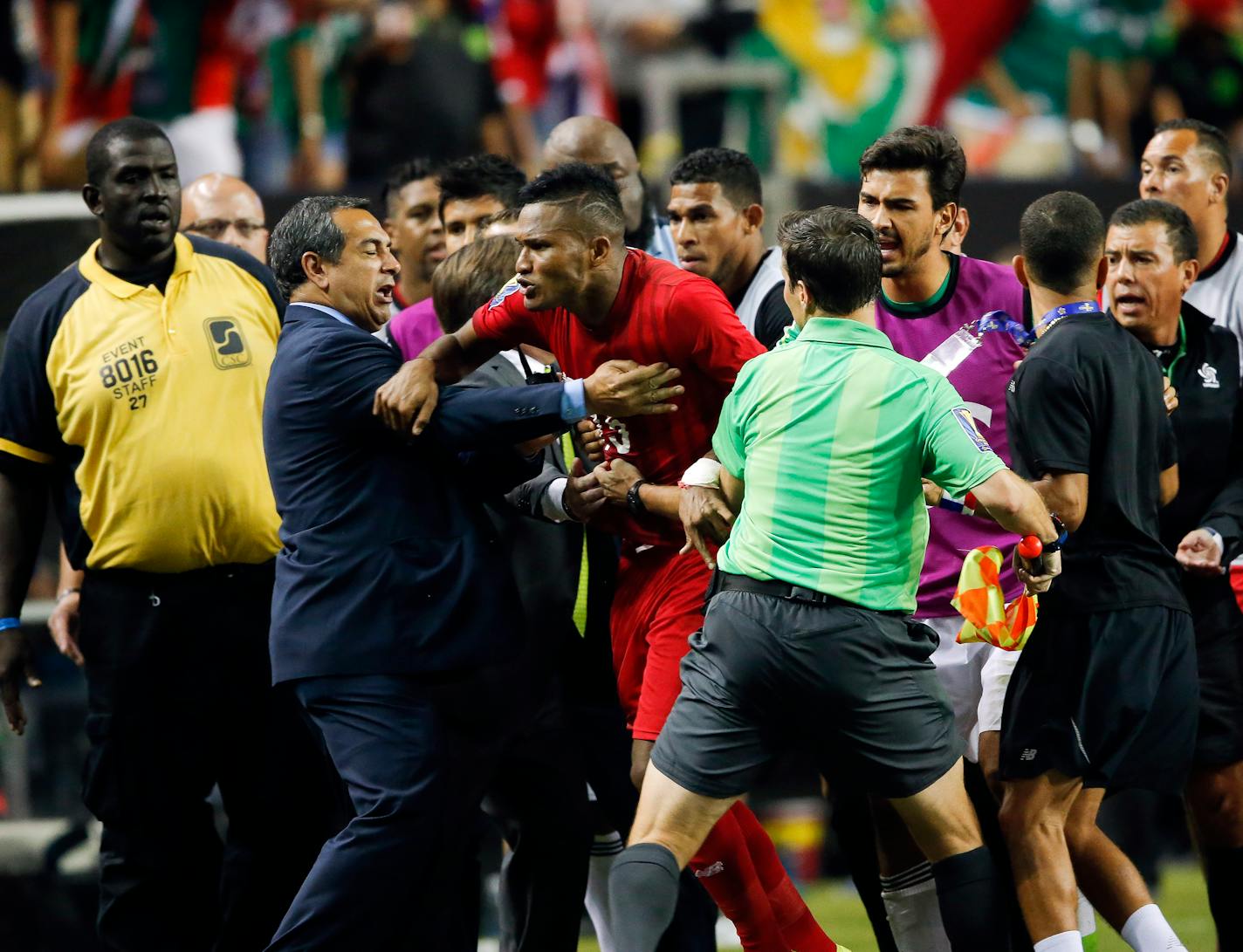 Panama's Erick Davis (15) was restrained as tempers flared during the second half of a CONCACAF Gold Cup soccer semifinal between Panama and Mexico on Wednesday. Mexico won 2-1 in extra time.