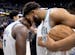 The Timberwolves' Anthony Edwards, left, and Karl-Anthony Towns celebrate their win over the Nuggets in the final minute of Game 7 of the Western Conf