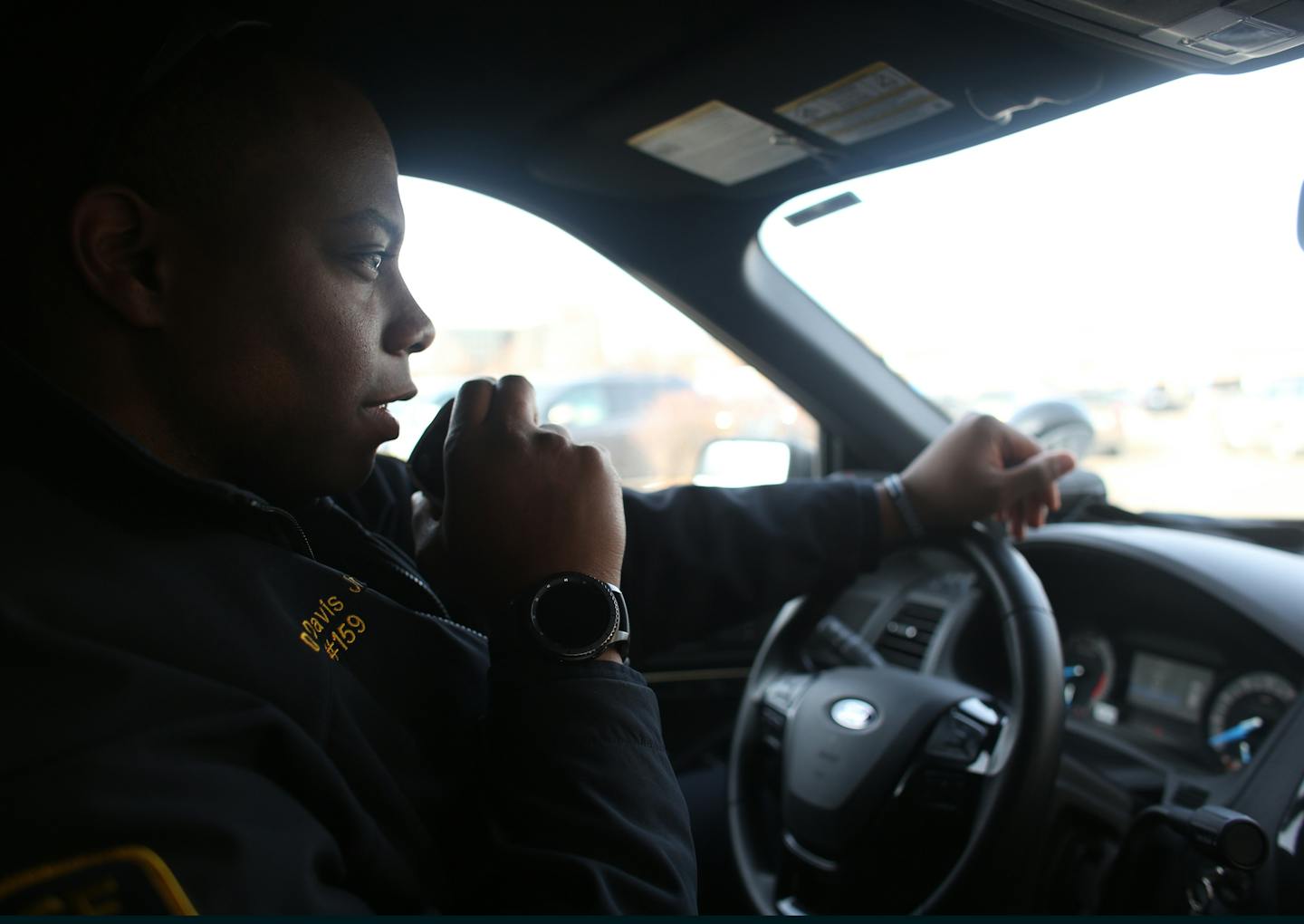 Edina officer Darren Davis Jr. answered question from dispatch about an earlier arrest while patrolling Southdale Mall. ] (KYNDELL HARKNESS/STAR TRIBUNE) kyndell.harkness@startribune.com Edina officer Darren Davis Jr. works his morning shift. Friday, December 22, 2017. More suburban police departments like Edina are thinking about going to 12-hour shifts.