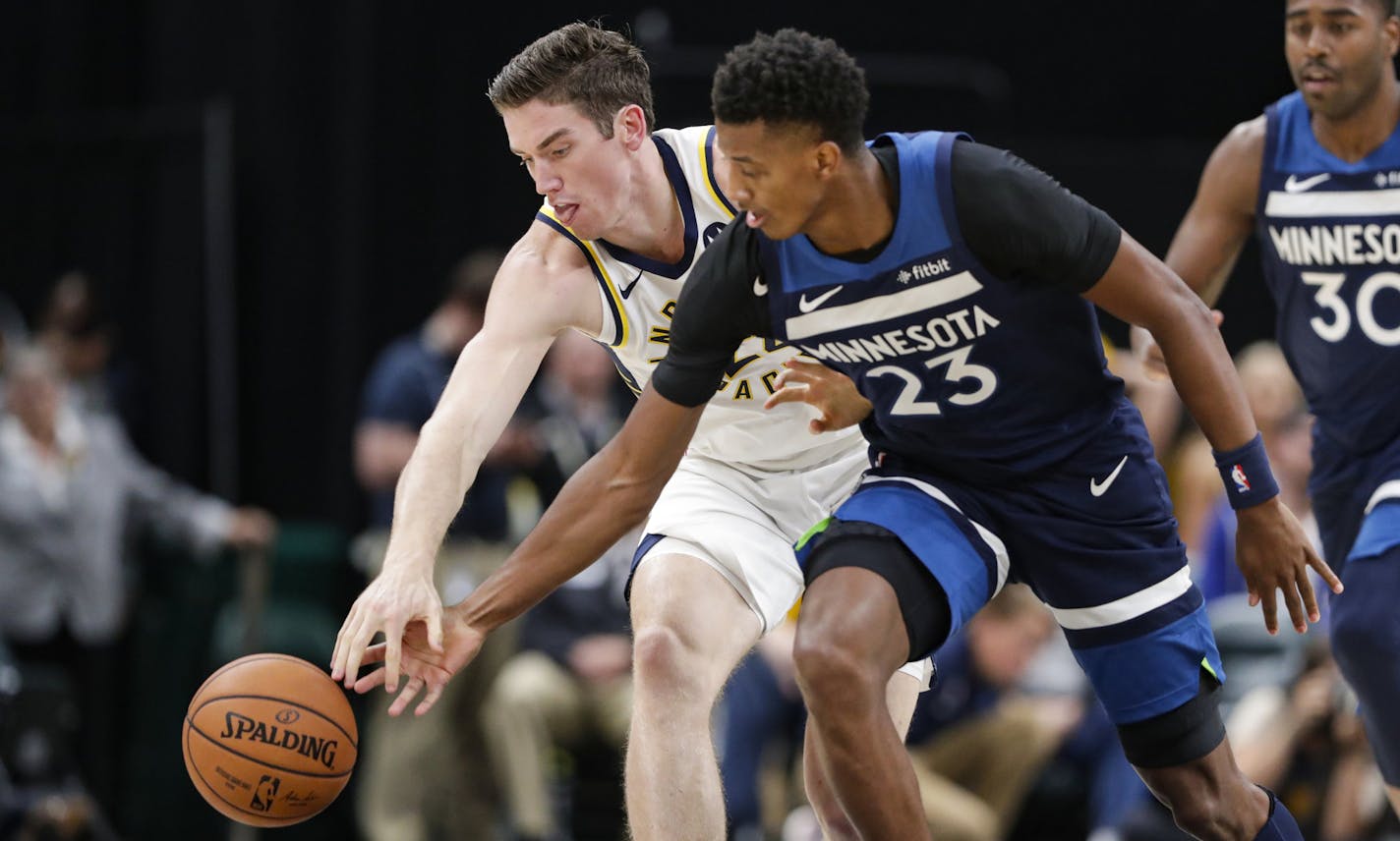 Indiana Pacers forward T.J. Leaf and Minnesota Timberwolves guard Jarrett Culver (23) go for a loose ball during the second half of an NBA preseason basketball game in Indianapolis, Tuesday, Oct. 15, 2019. (AP Photo/Michael Conroy)