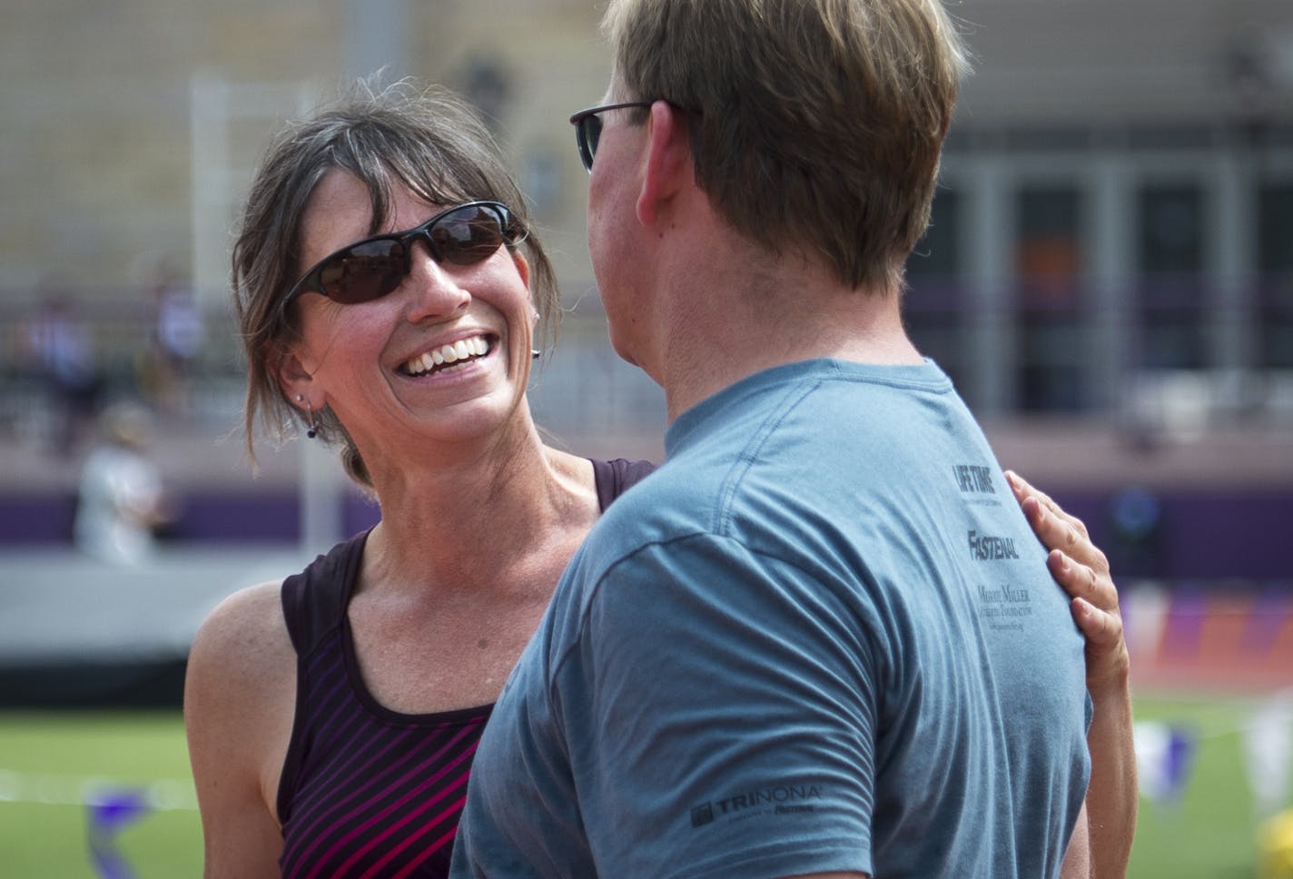 Polly Wieczorek greeted her husband, David, between throws during the 50-54 shot-put competition Monday. ] Aaron Lavinsky &#x2022; aaron.lavinsky@startribune.com Coverage of the National Senior Games at the University of St. Thomas on Monday, July 13, 2015. We focus on 50-54 women's shot-put.