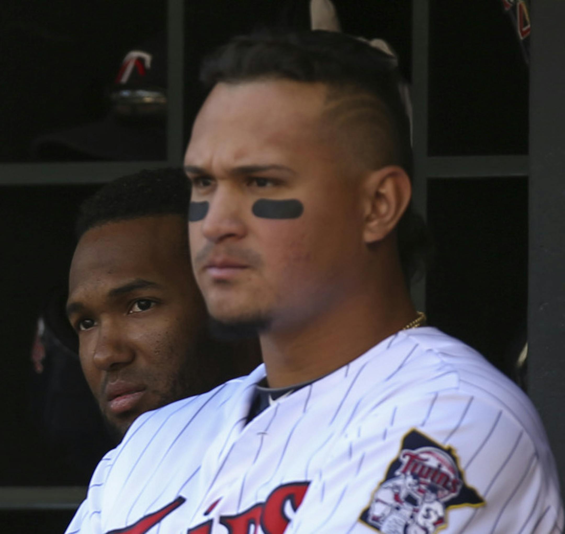 Twins shortstop Danny Santana and right fielder Oswaldo Arcia, right, watched a teammate's at bat in the fifth inning Sunday afternoon at Target Field. ] JEFF WHEELER &#x201a;&#xc4;&#xa2; jeff.wheeler@startribune.com The Twins lost 7-2 to the Cleveland Indians Sunday afternoon September 21, 2014 at Target Field in Minneapolis.