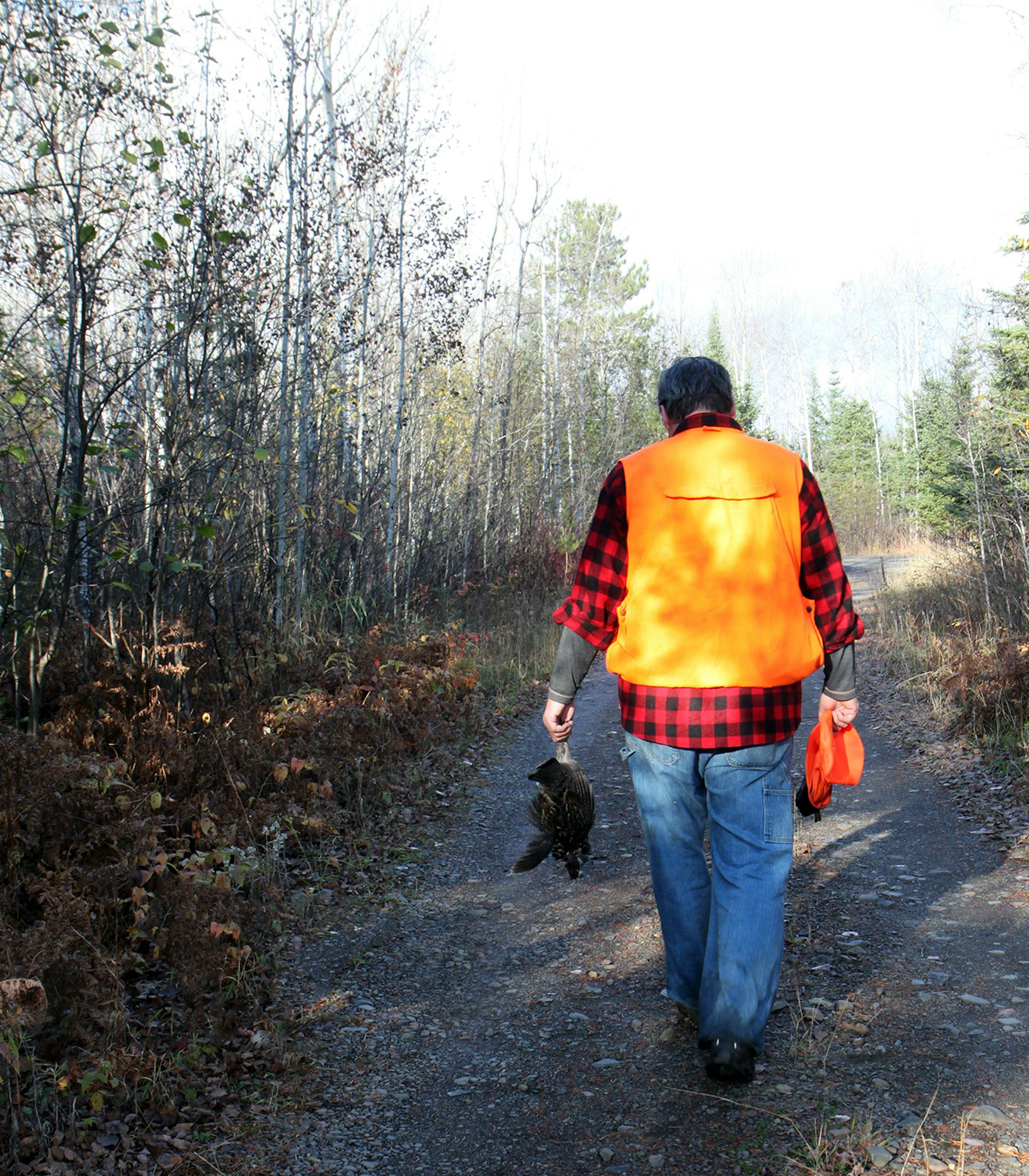 Photo by Mary Jo Hoffman, Special to the Star Tribune Steve Hoffman, with his grouse catch, for hunting story by Steve Hoffman.