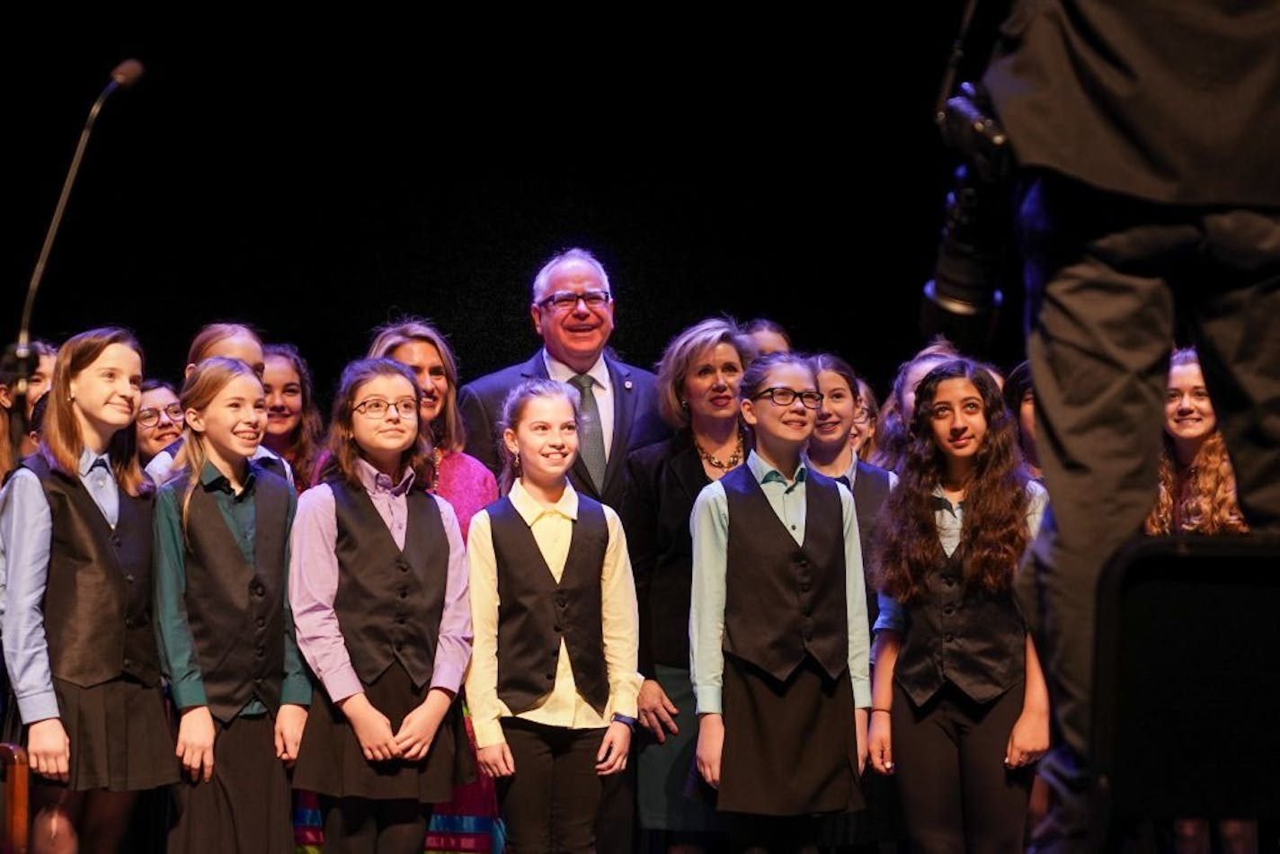 Tim Walz posed for a photo with the Minneapolis Youth Chorus before his swearing in ceremony. On the left is Lt. Gov.-elect Peggy Flanagan. On the right his wife Gwen.