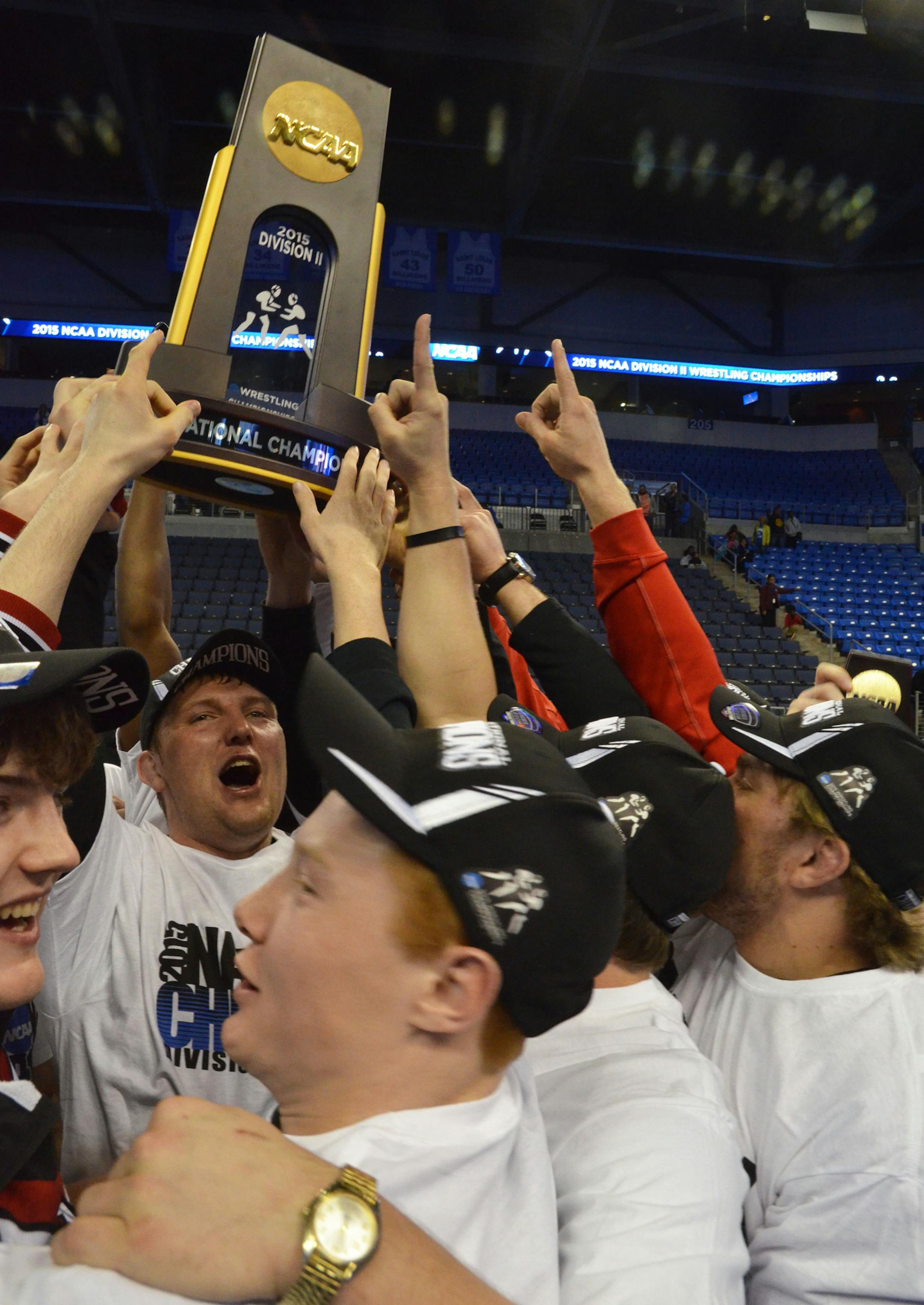 Members of the St. Cloud State wrestling team celebrate their Division II championship Saturday. Photo courtesy of St. Cloud State.