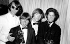 June 4, 1967: Mike Nesmith, Davy Jones, Peter Tork, and Micky Dolenz of the Monkees posing with their Emmy award for best comedy series.