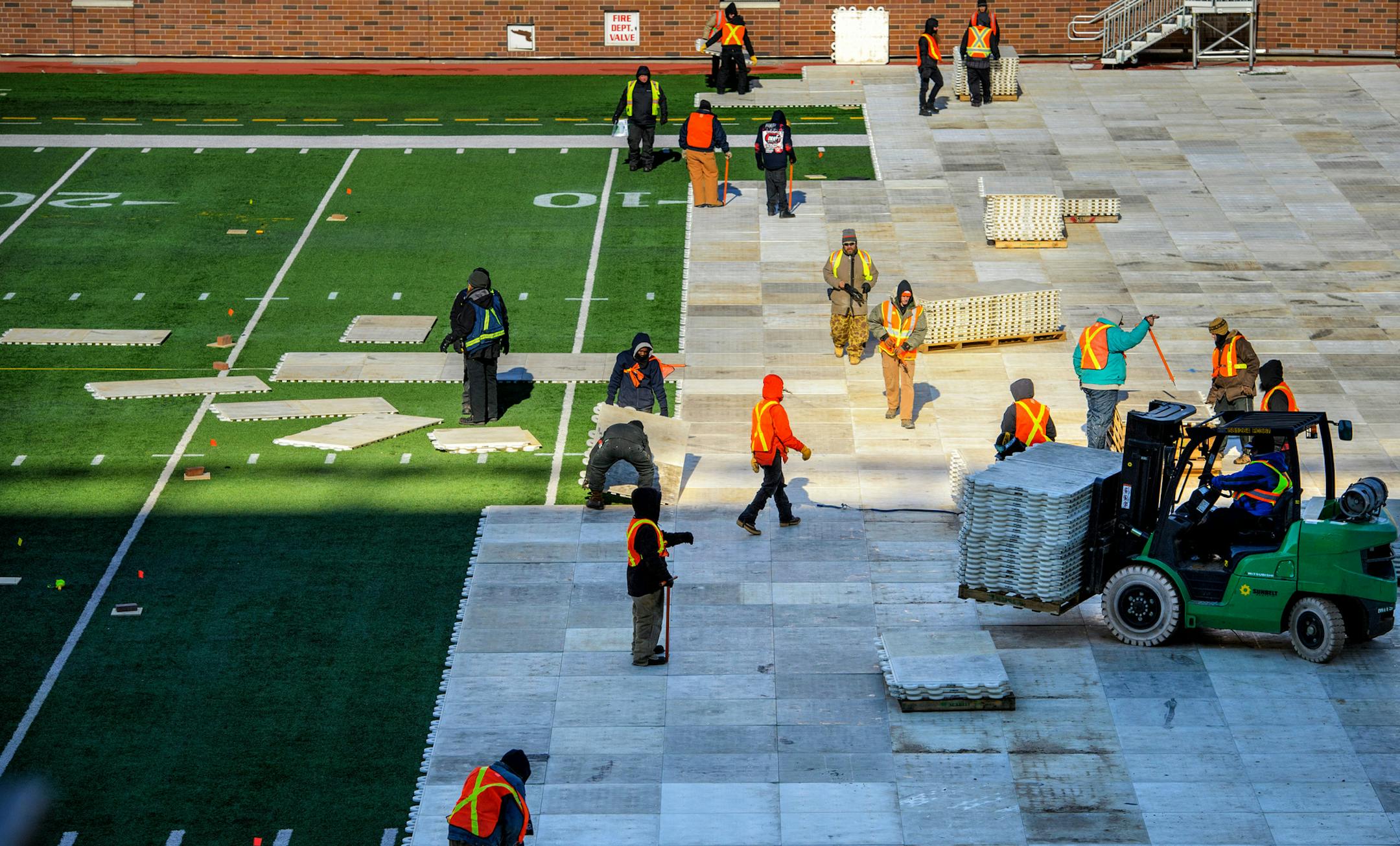 In below zero wind chills, workers began laying down the first pieces of flooring as TCF Bank Stadium began the transformation from football field to hockey rink for the NHL Stadium Series February 20 and 21. ] GLEN STUBBE * gstubbe@startribune.com Tuesday, February 9, 2016 The National Hockey League kicks-off the countdown to the 2016 Coors Light NHL Stadium Series(tm) as the transformation begins of turning the Minnesota Golden Gophers football field into a world-class hockey rink.