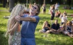 John Bauer of Minnetonka dances with Lynn Schultz of Minneapolis while Gary Louris and the Jayhawks play during the Walker's Summer Music and Movies i