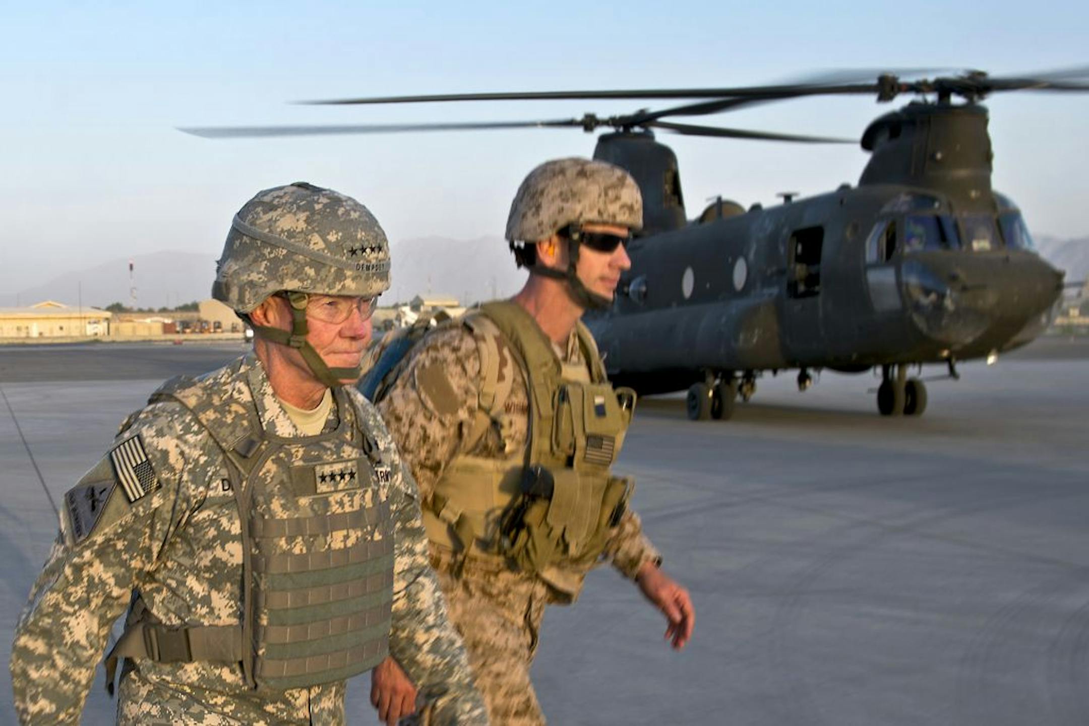 In this image released by the U.S. Department of Defense and taken Monday, Aug. 20, 2012, Army Gen. Martin E. Dempsey, chairman of the Joint Chiefs of Staff, prepares to board a CH-47 at Kabul International Airport in Kabul, Afghanistan.