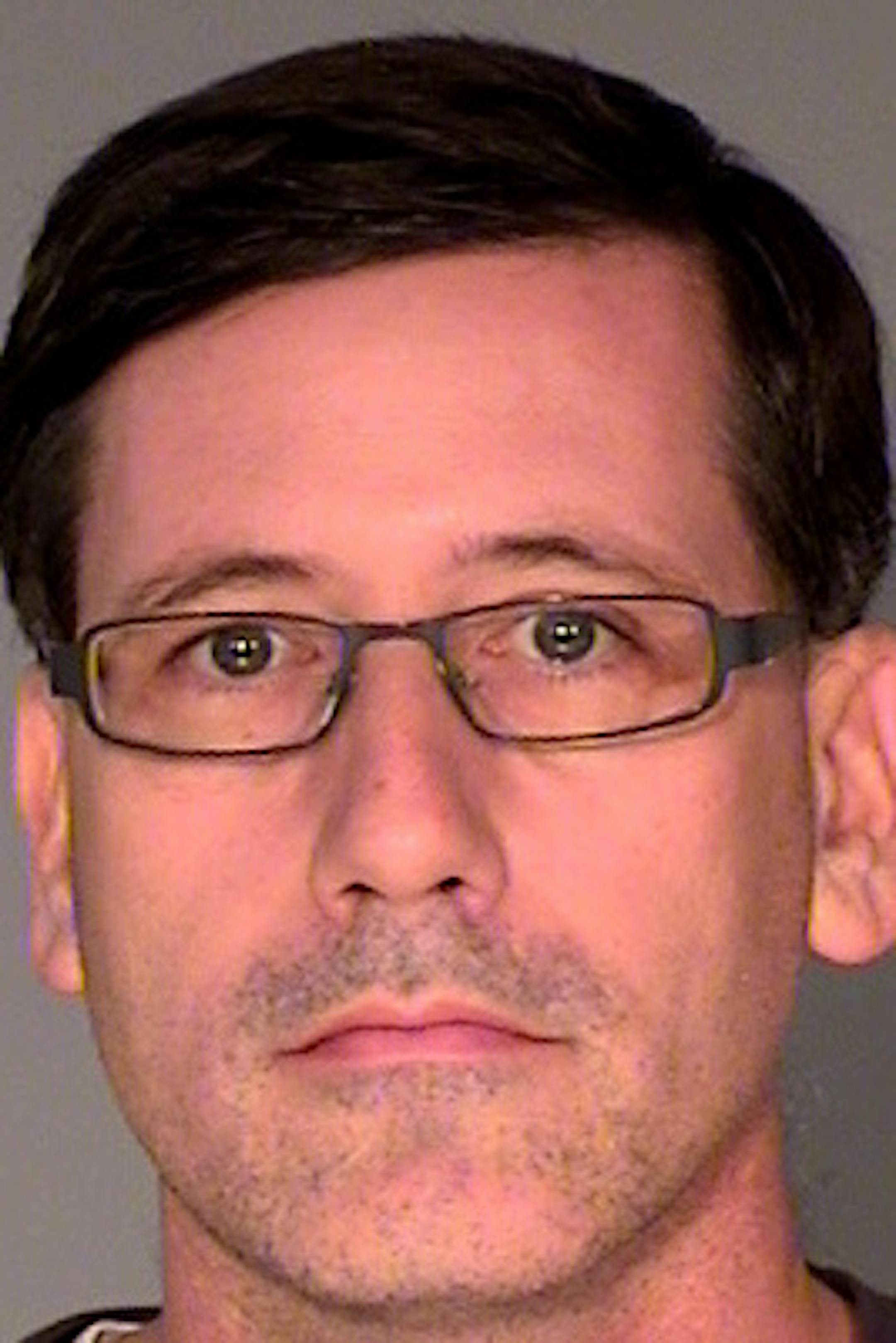 Michael J. Mangan, charged with aggravated stalking and terroristic threats for allegedly threatening to harm others.